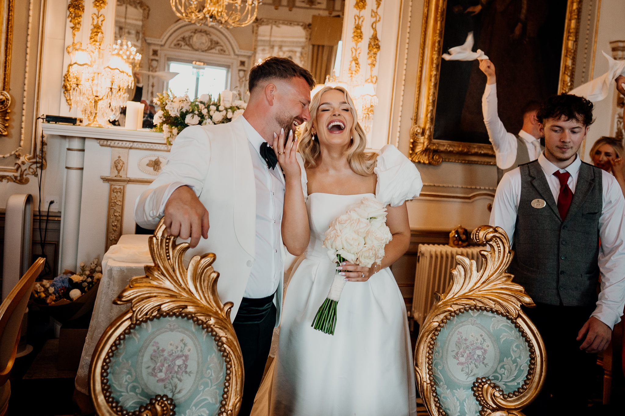 Bride and groom laughing together during their wedding reception in the Markree Castle Dining Room
