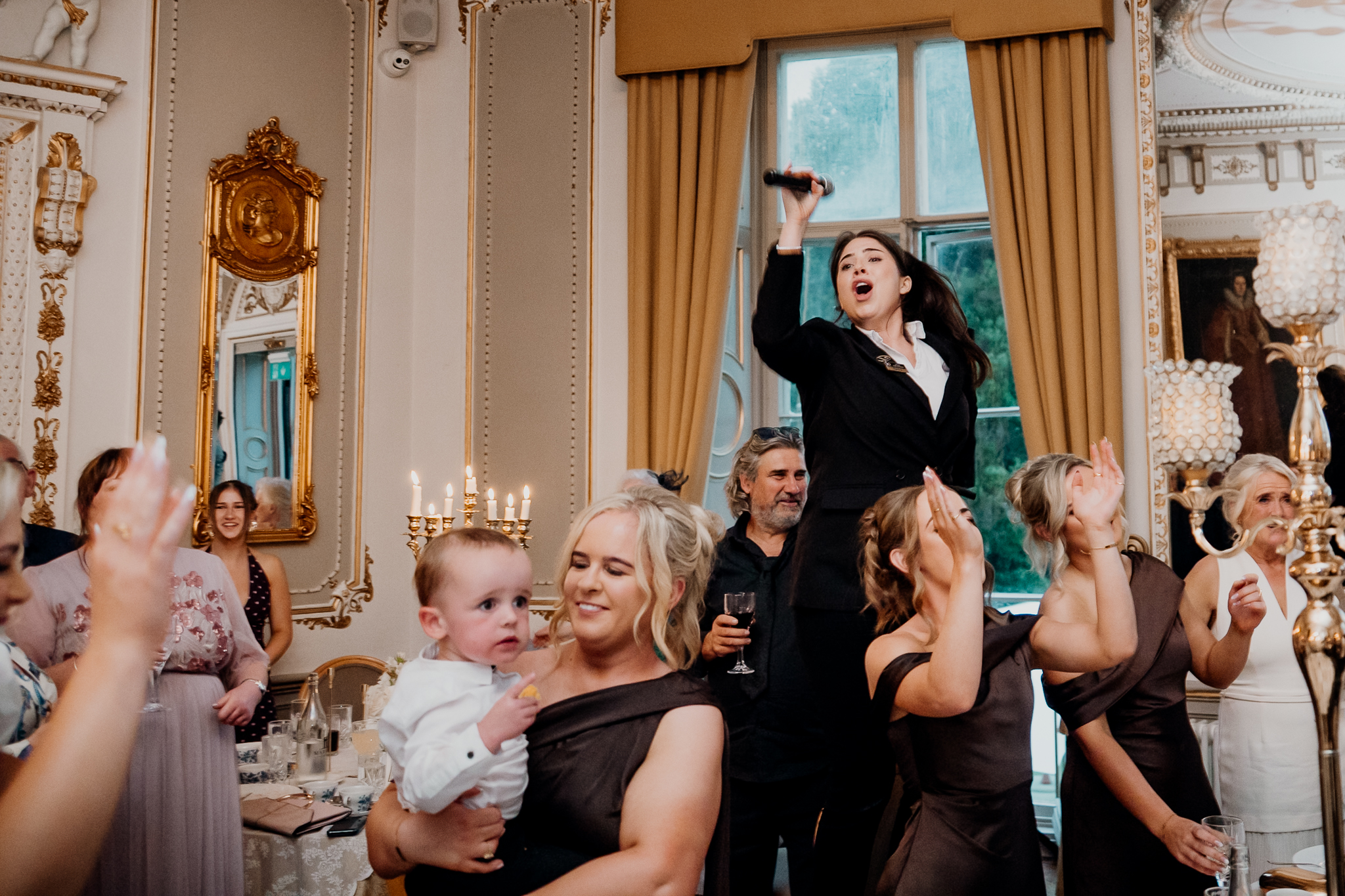 Surprise singer performing for wedding guests in the Dining Room at Markree Castle
