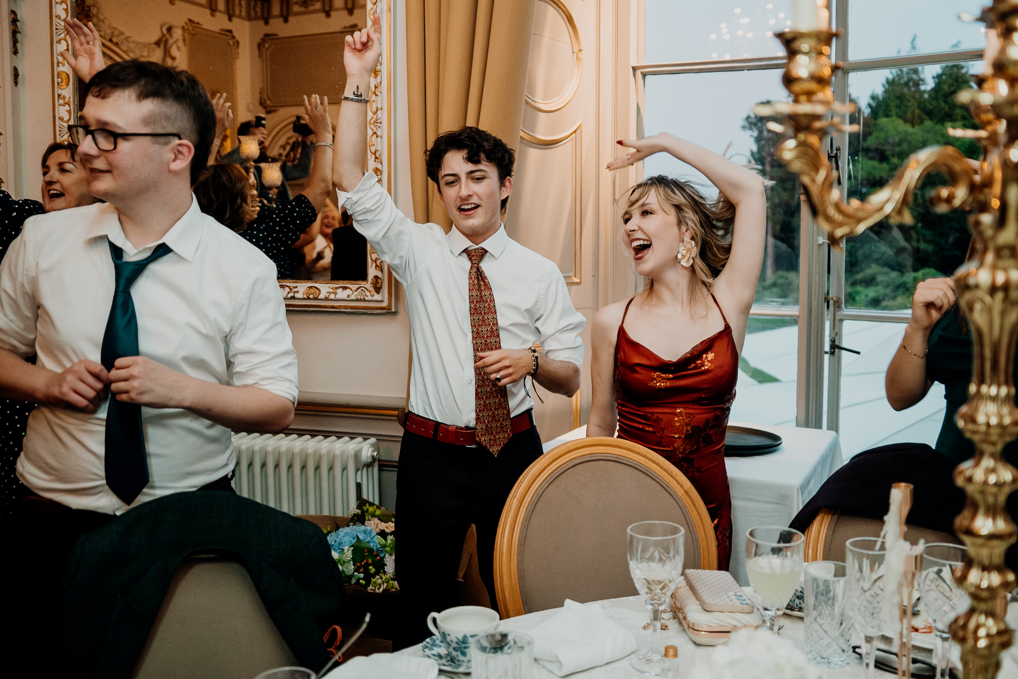 Wedding guests singing and dancing during surprise entertainment at Markree Castle