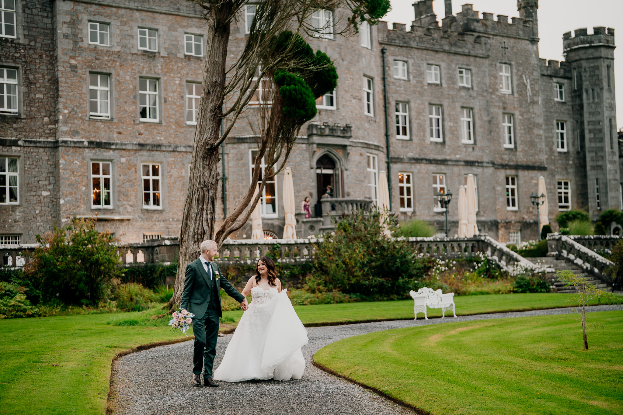 Bride and groom walking through the gardens at Markree Castle