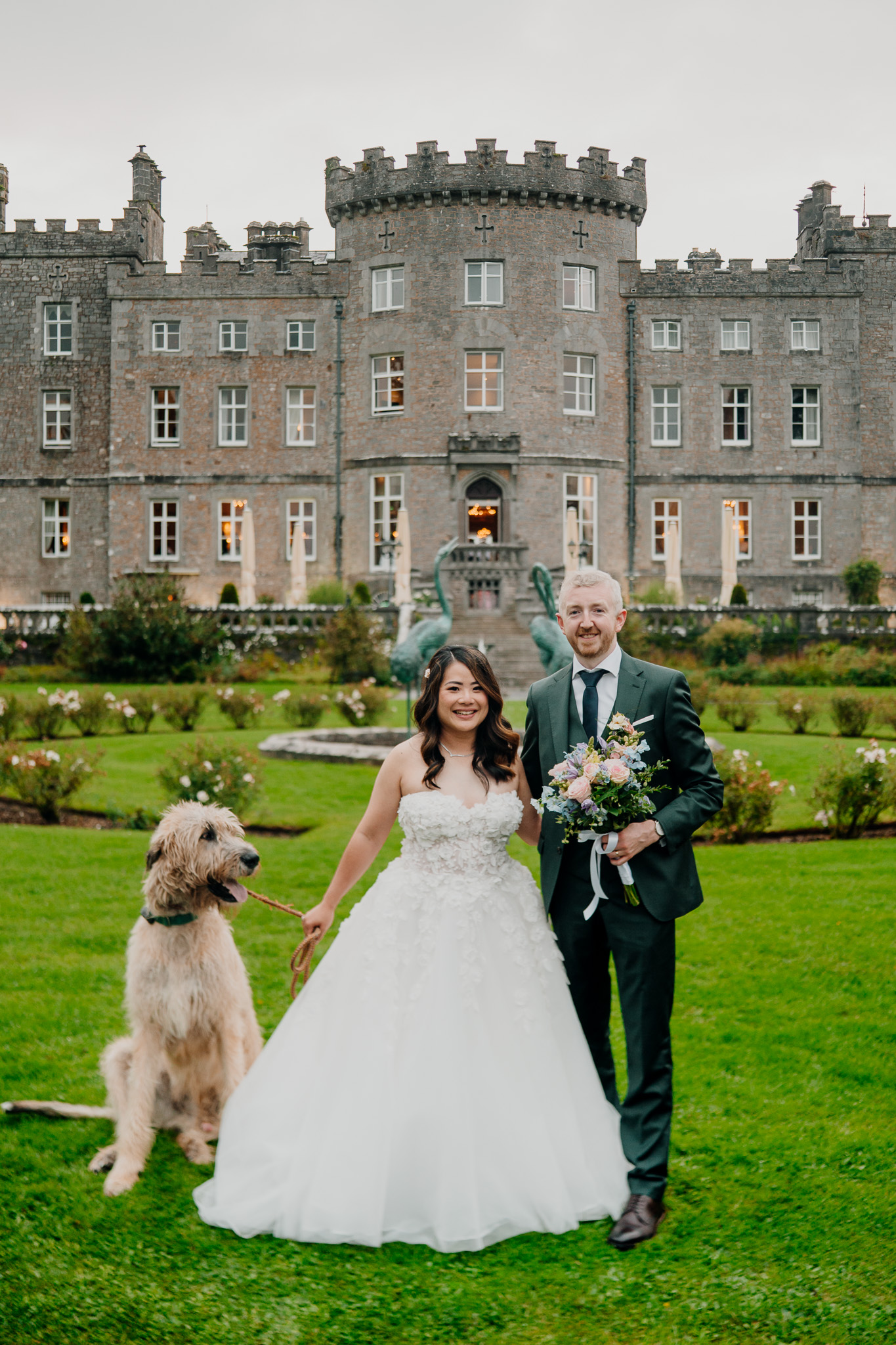 Bride and groom with Irish Wolfhound Fionn at Markree Castle