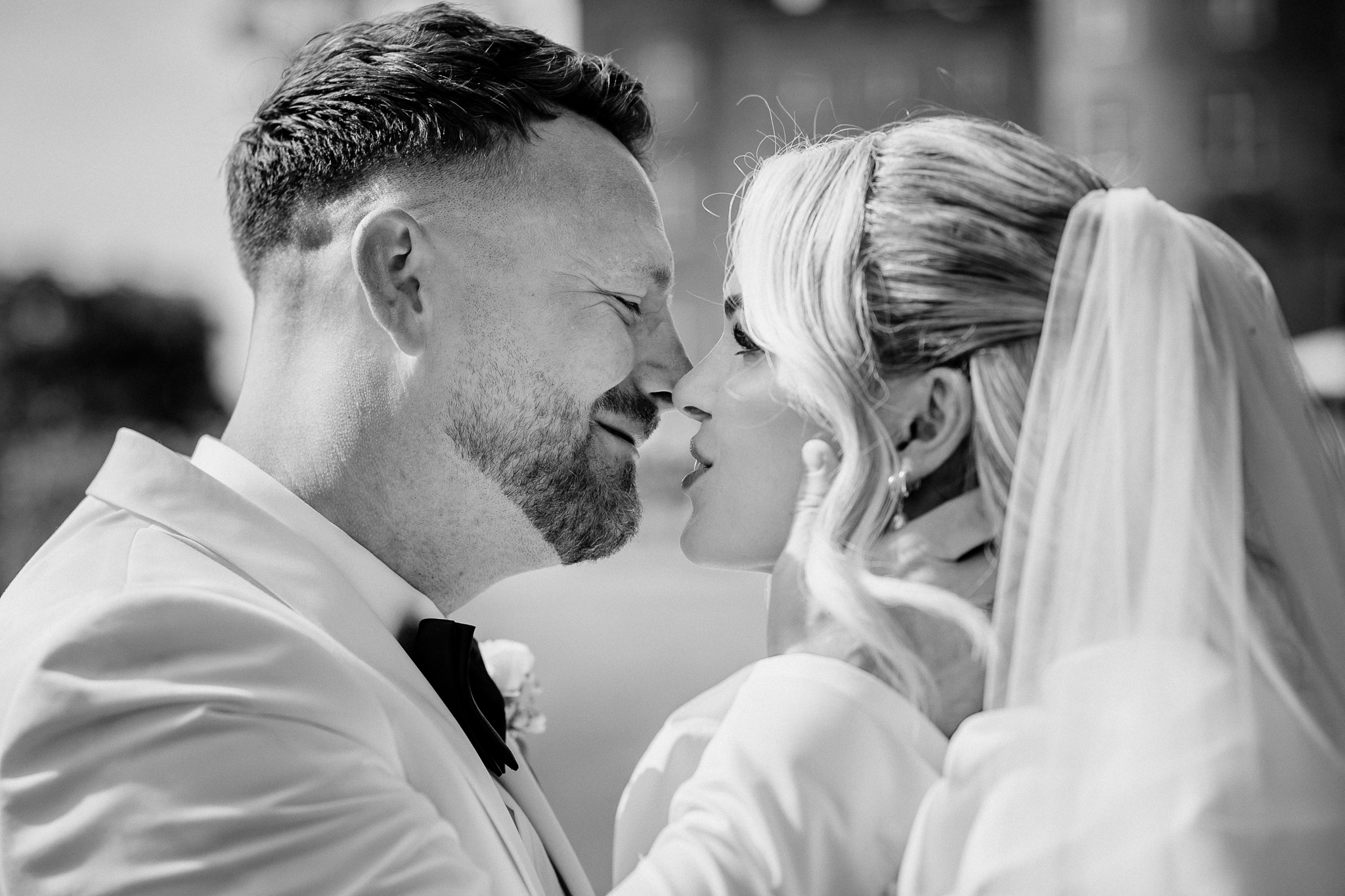 Bride and groom kissing beside the fountain at Markree Castle
