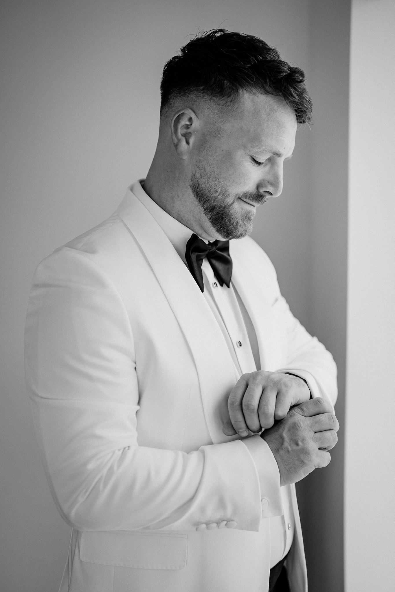 Black and white portrait of groom Michael getting ready at Markree Castle