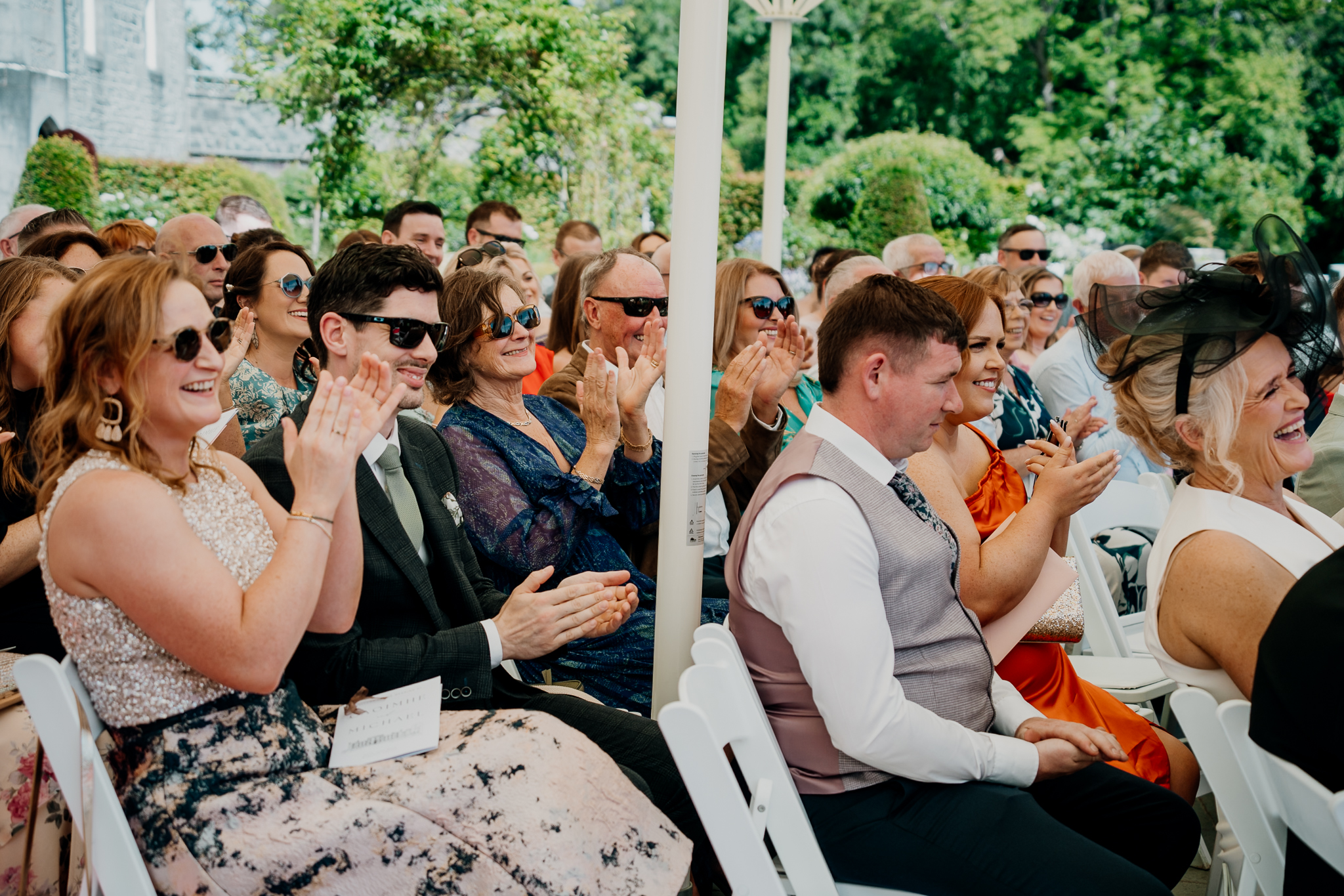 Wedding guests applauding during an outdoor ceremony at Markree Castle