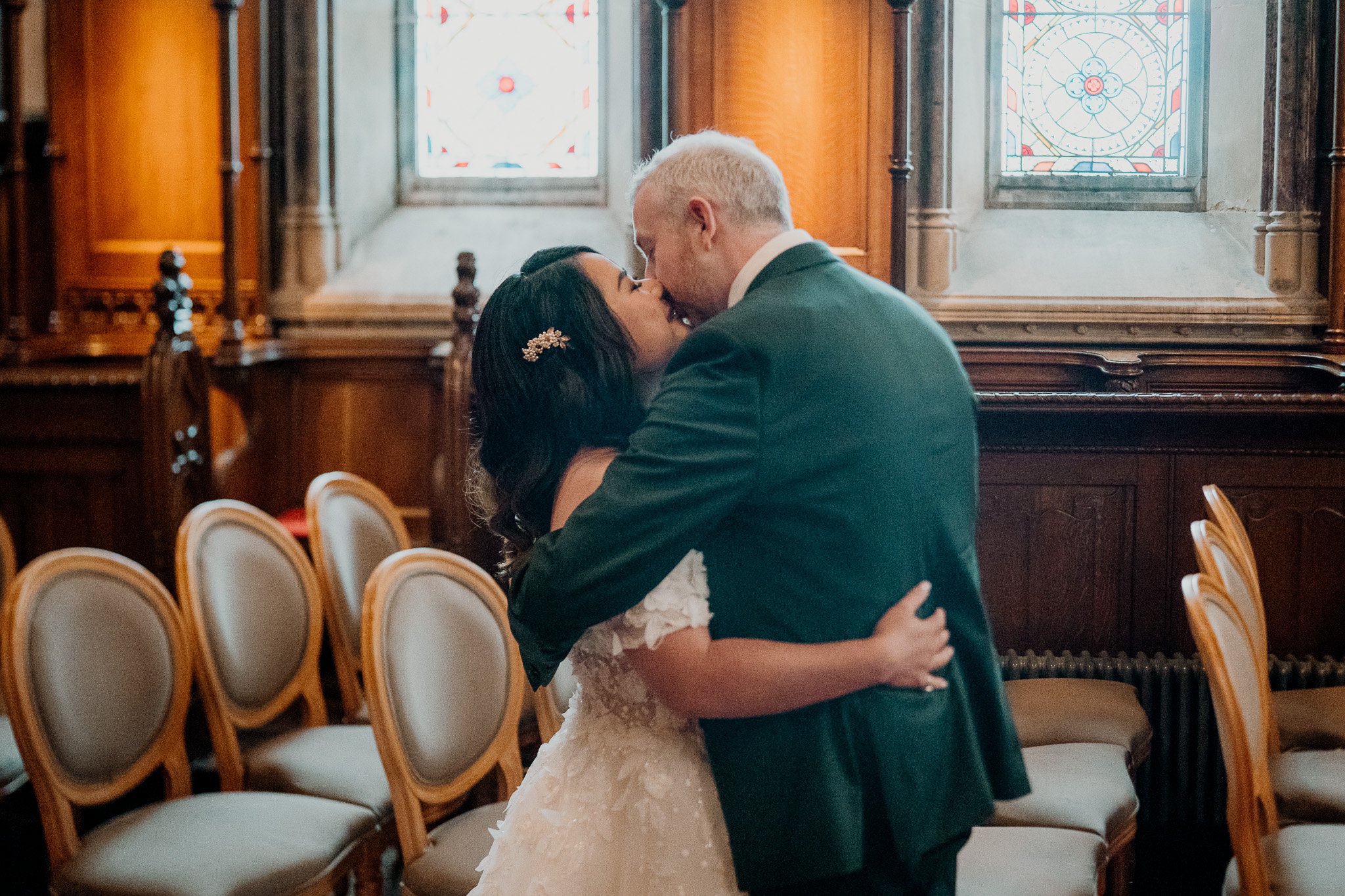 Bride and groom kissing after private vows in Markree Castle Chapel