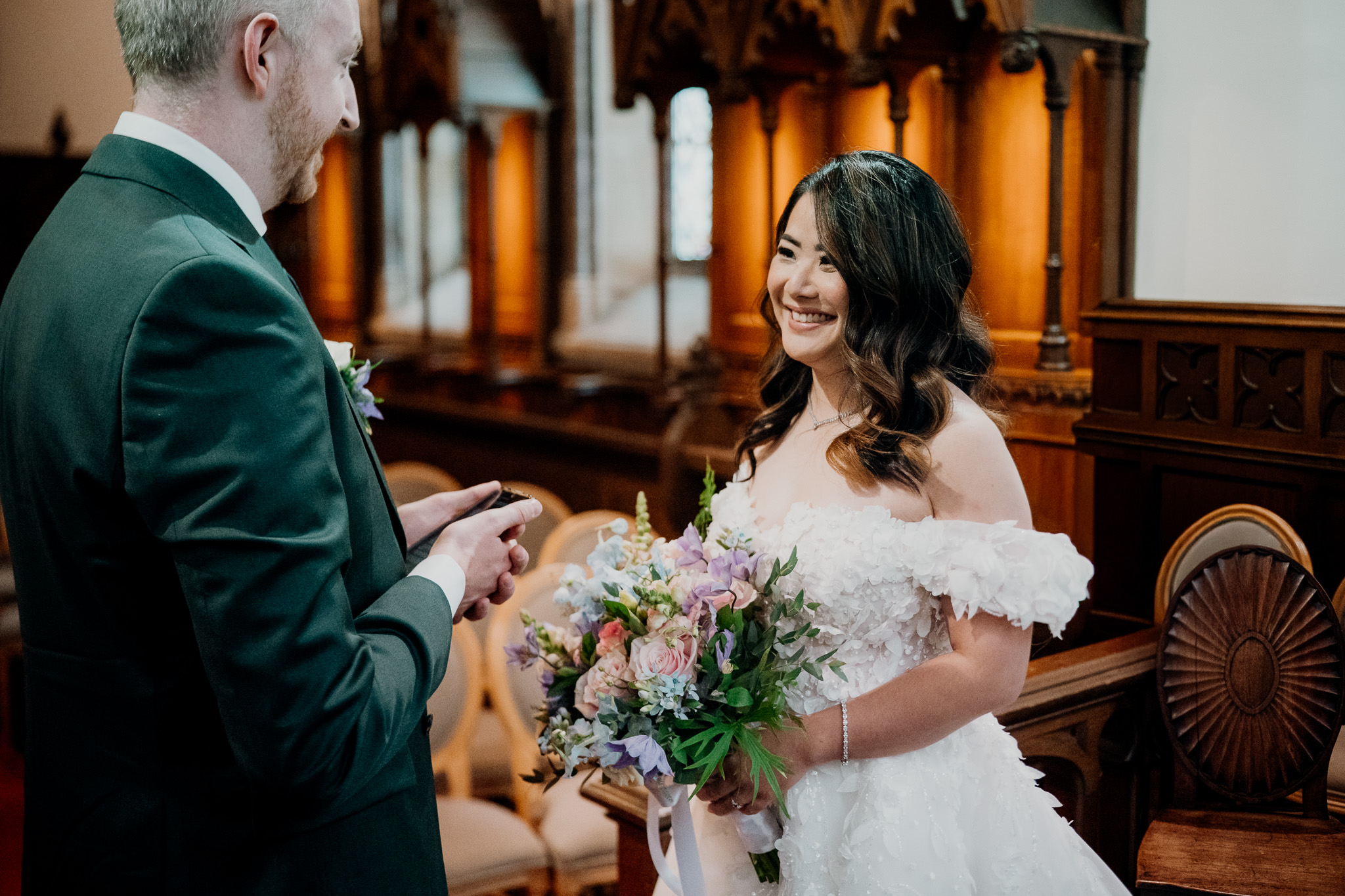 Bride reading private wedding vows at the altar in Markree Castle Chapel