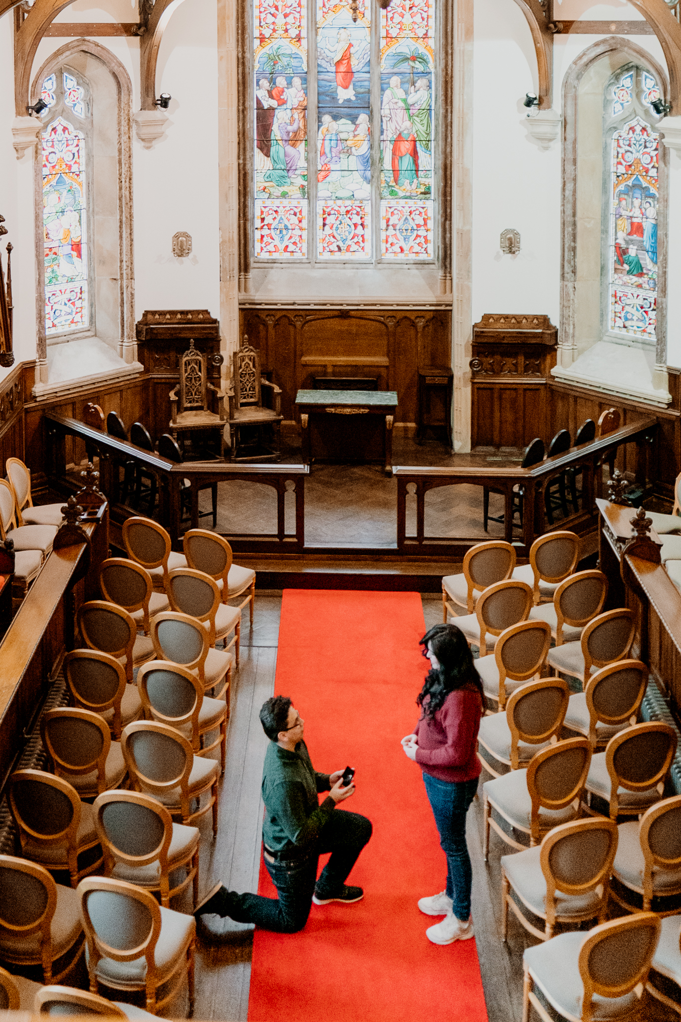 Surprise marriage proposal inside the chapel at Markree Castle in Sligo, Ireland, photographed from above.
