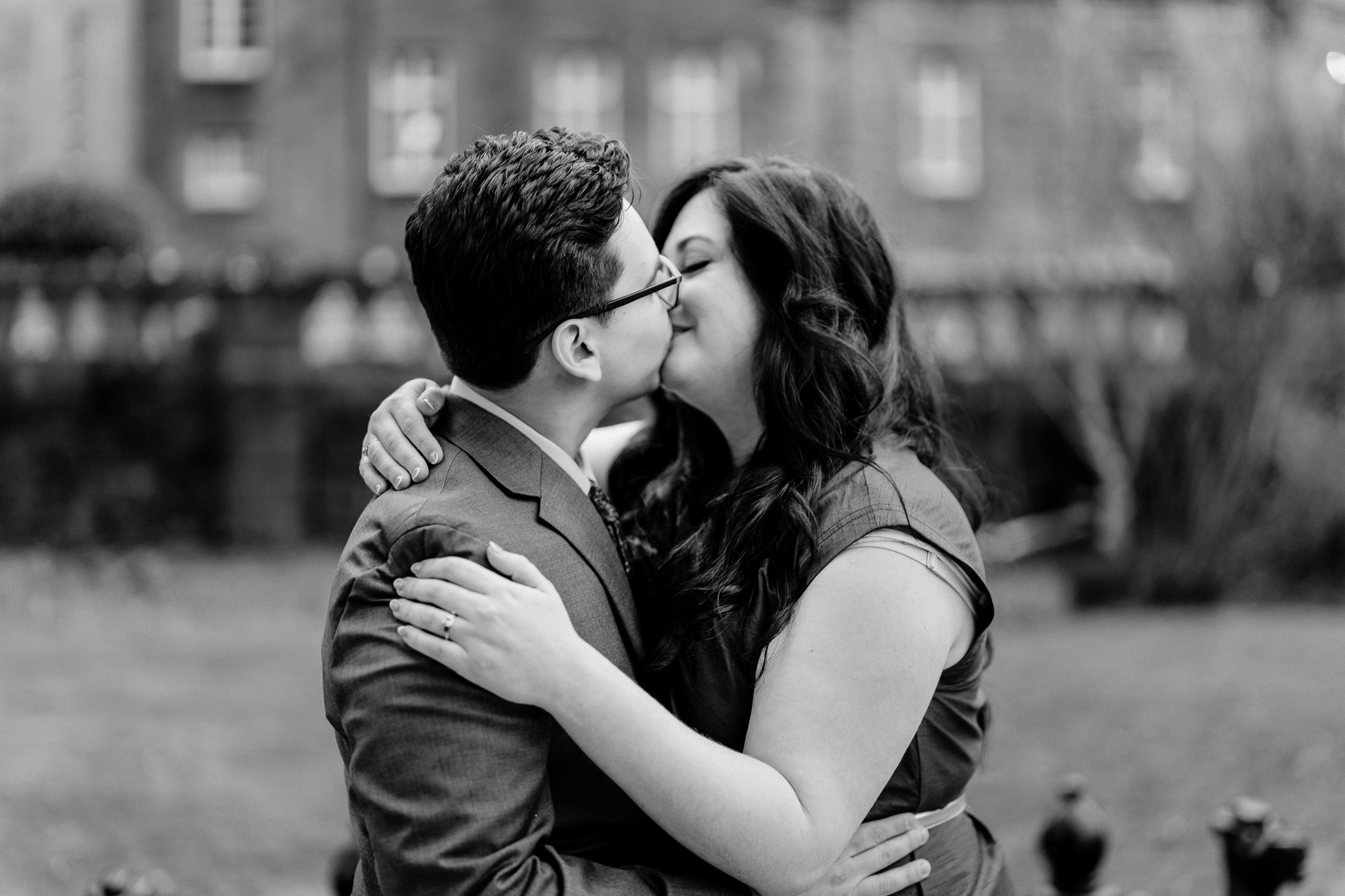 Black-and-white engagement portrait of a couple kissing at Markree Castle in Sligo after their surprise marriage proposal.