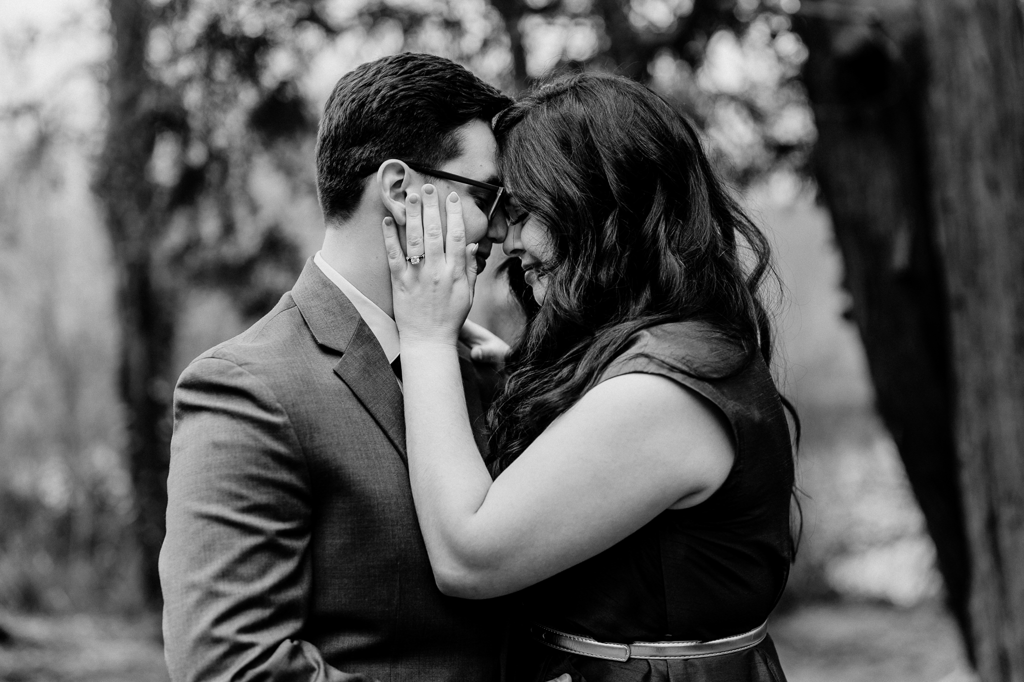 Black-and-white close-up of a couple kissing during their romantic engagement photography session at Markree Castle in Sligo, Ireland.