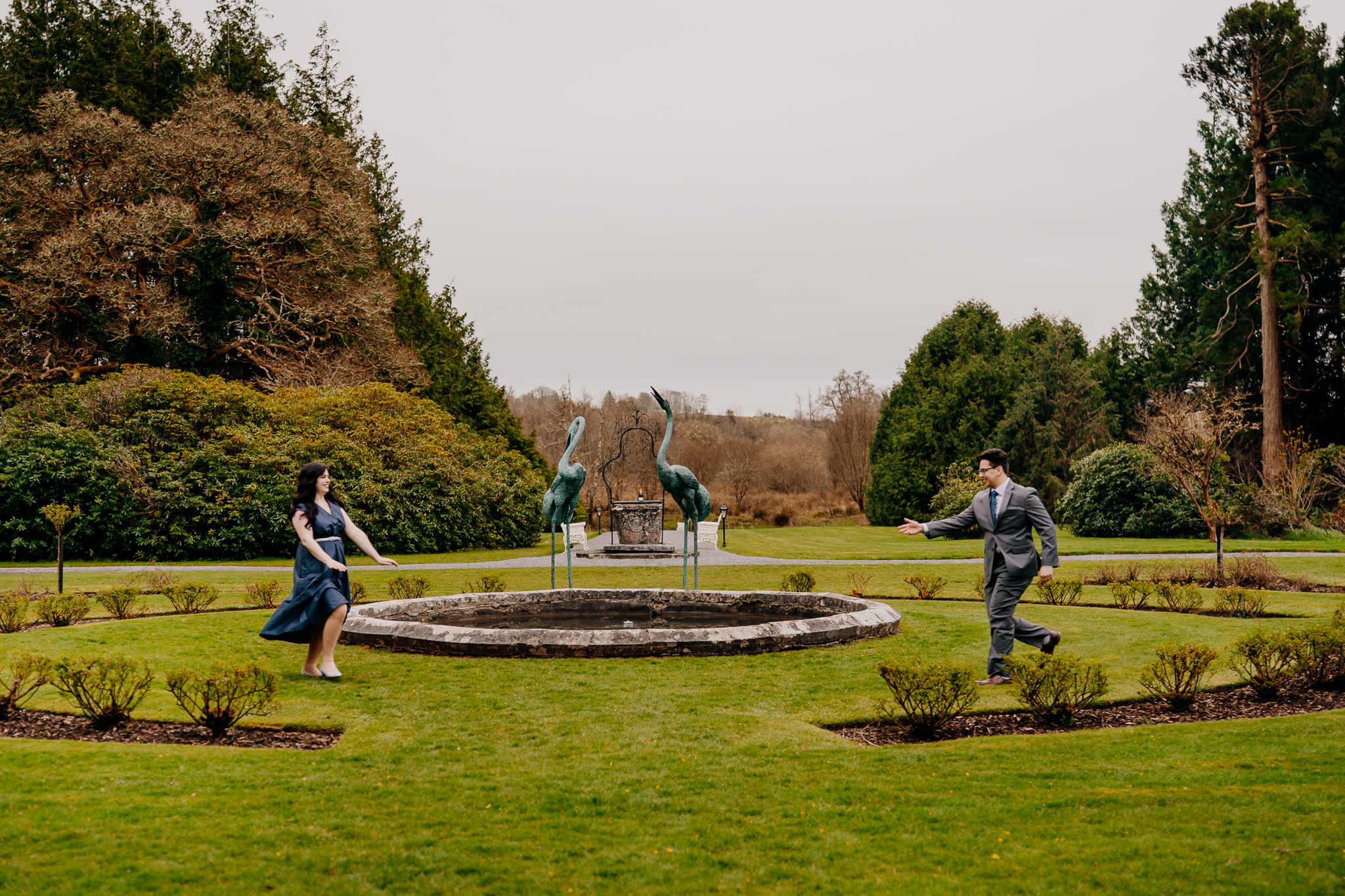 A romantic engagement photograph featuring a newly engaged couple with the historic Markree Castle as their backdrop. Part of a real surprise proposal and engagement photography story by Wojciech Koza in Ireland.