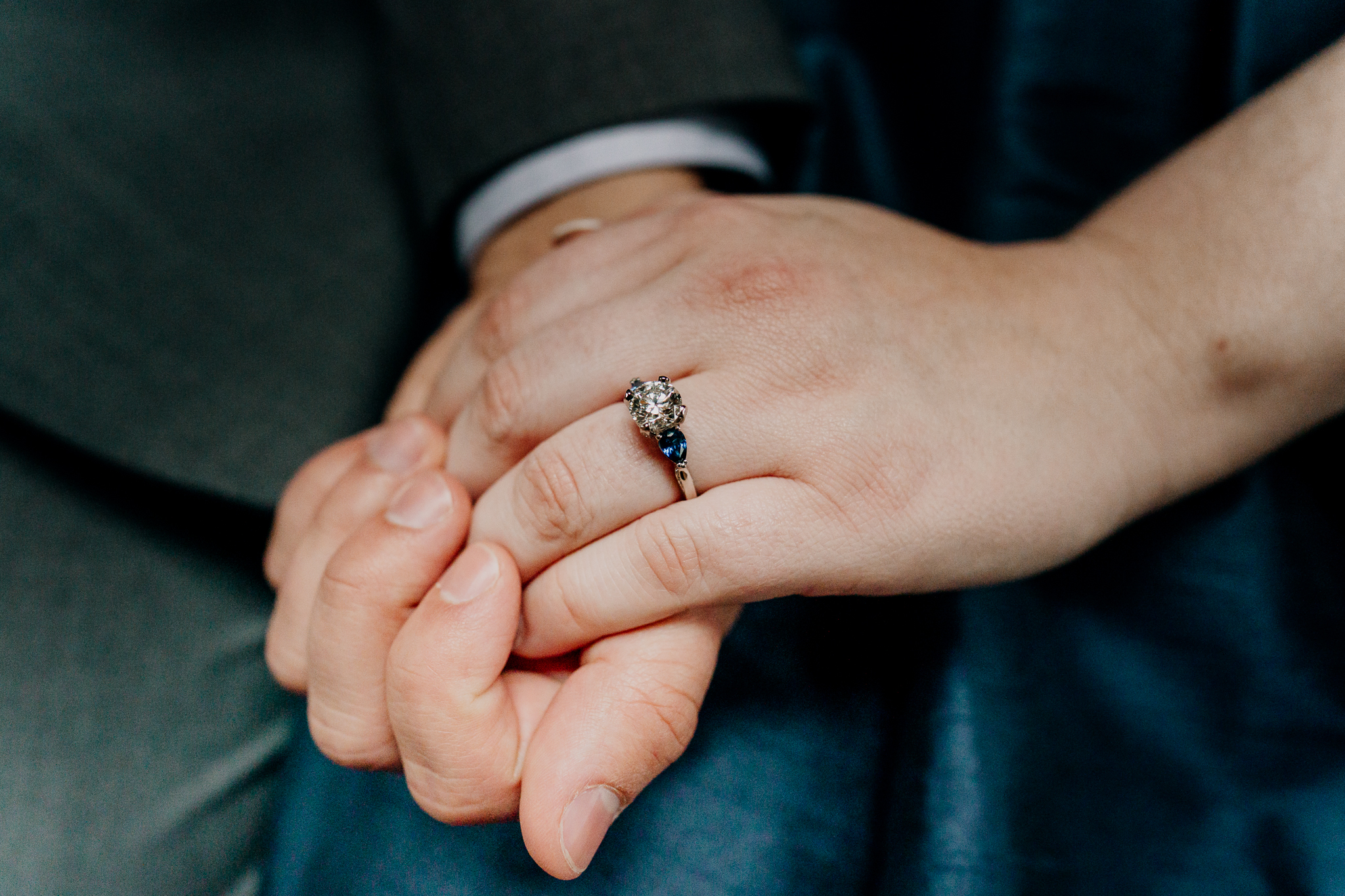 Close-up of a diamond engagement ring on a woman's hand after a romantic surprise proposal at Markree Castle in Sligo, Ireland.