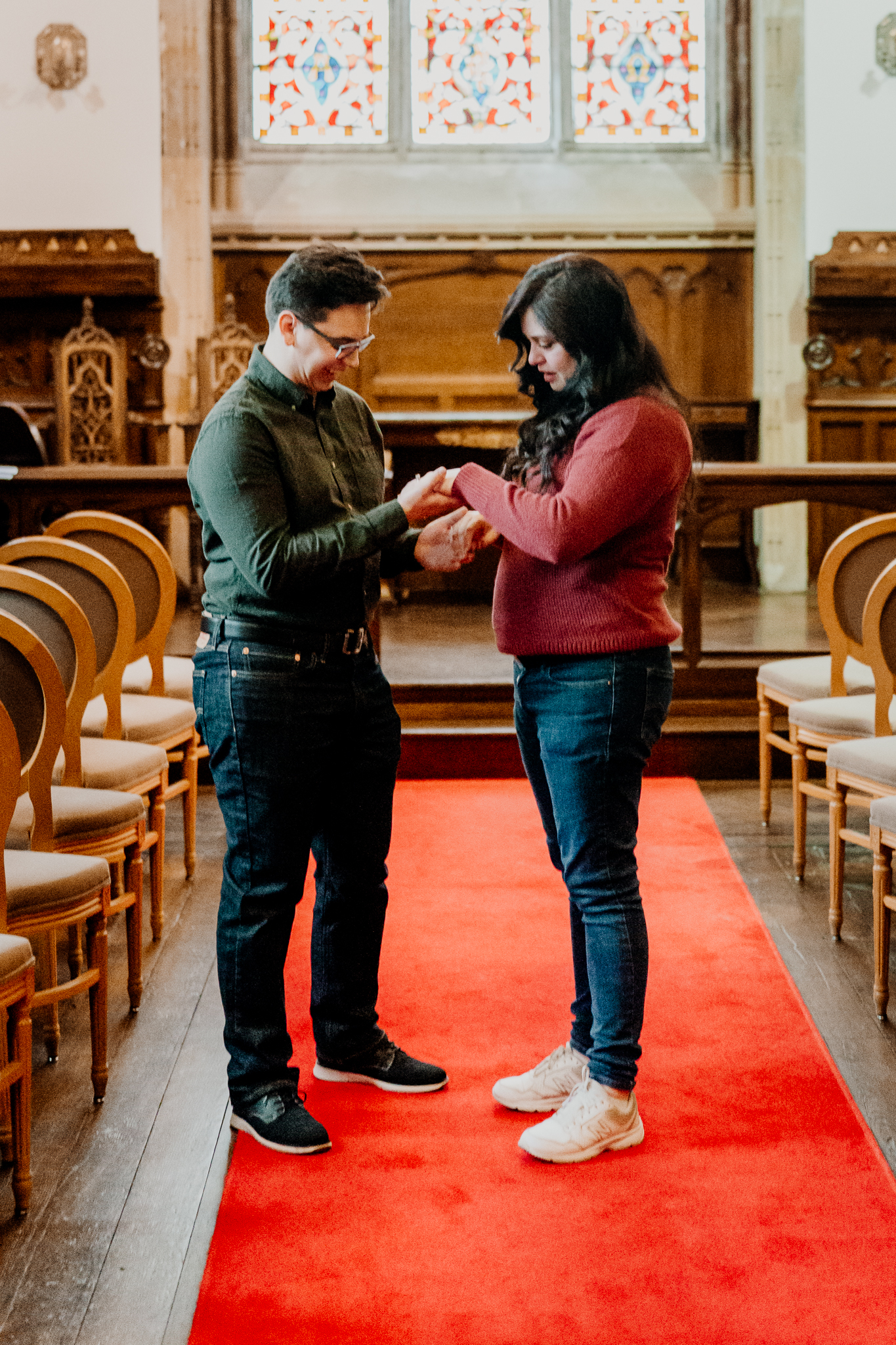 Surprise marriage proposal inside Markree Castle chapel, with a man on one knee presenting an engagement ring to his partner.