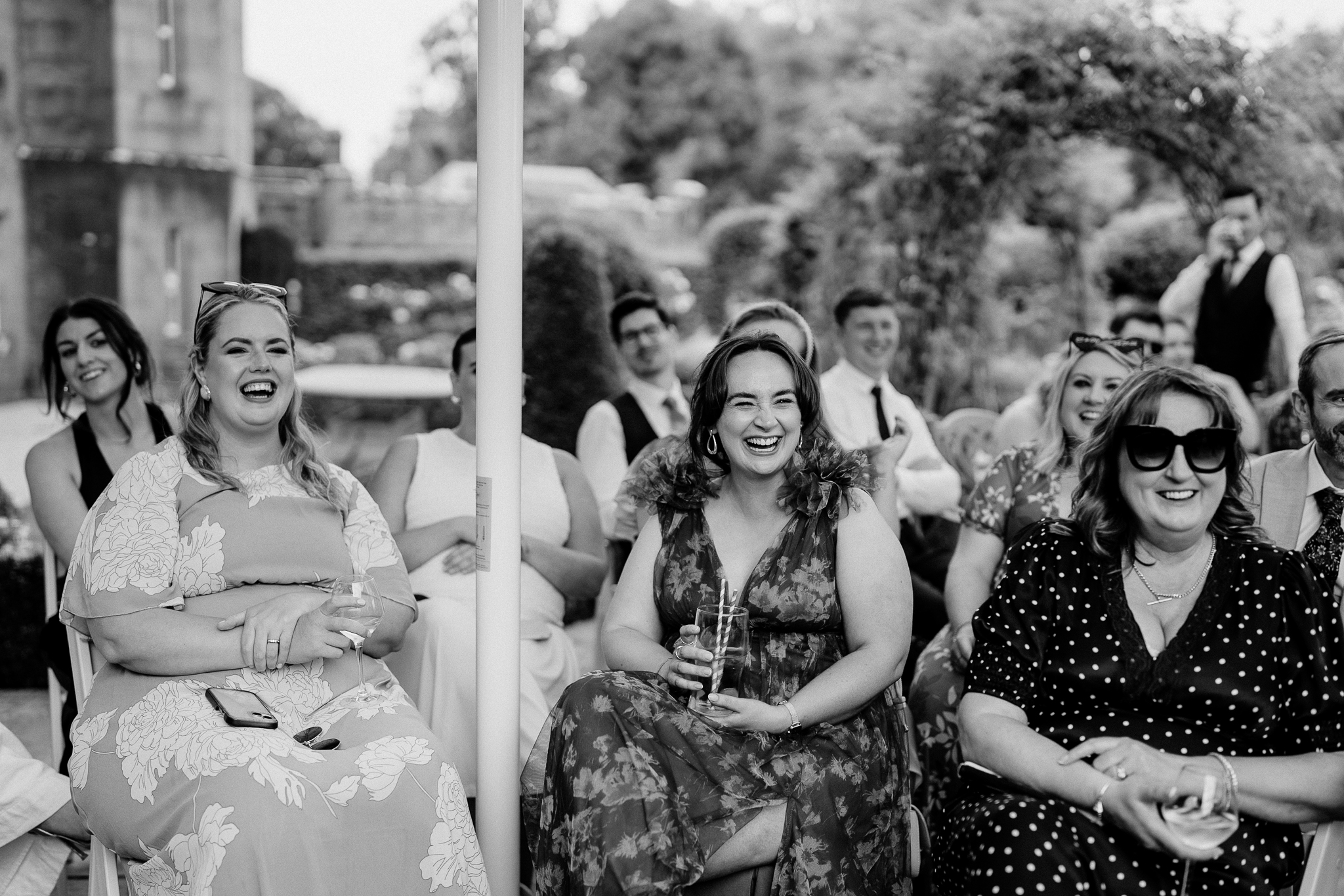 Bride Caoimhe laughing with guests during wedding speeches at Markree Castle