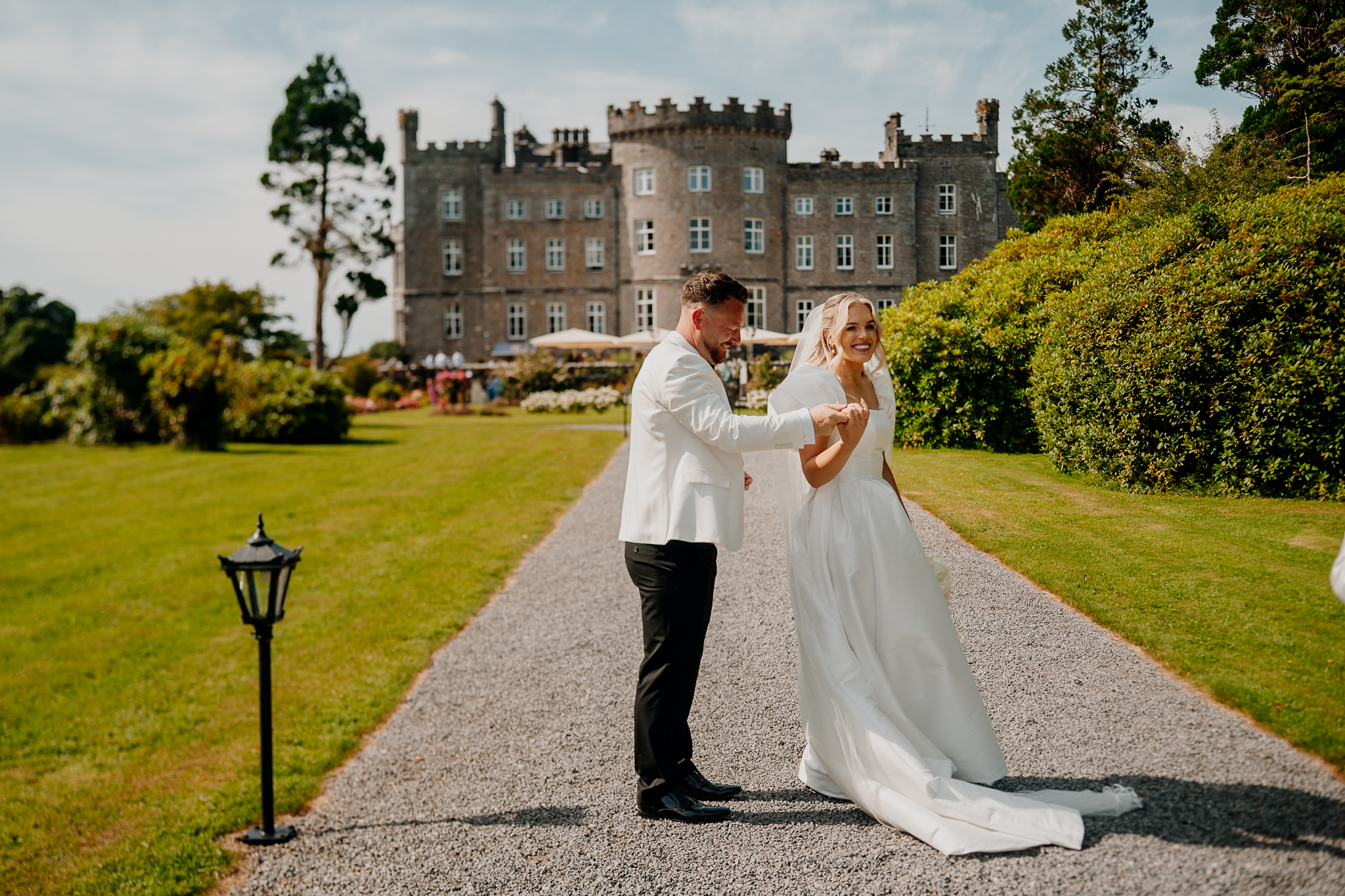 Caoimhe and Michael by the river with Markree Castle in the background