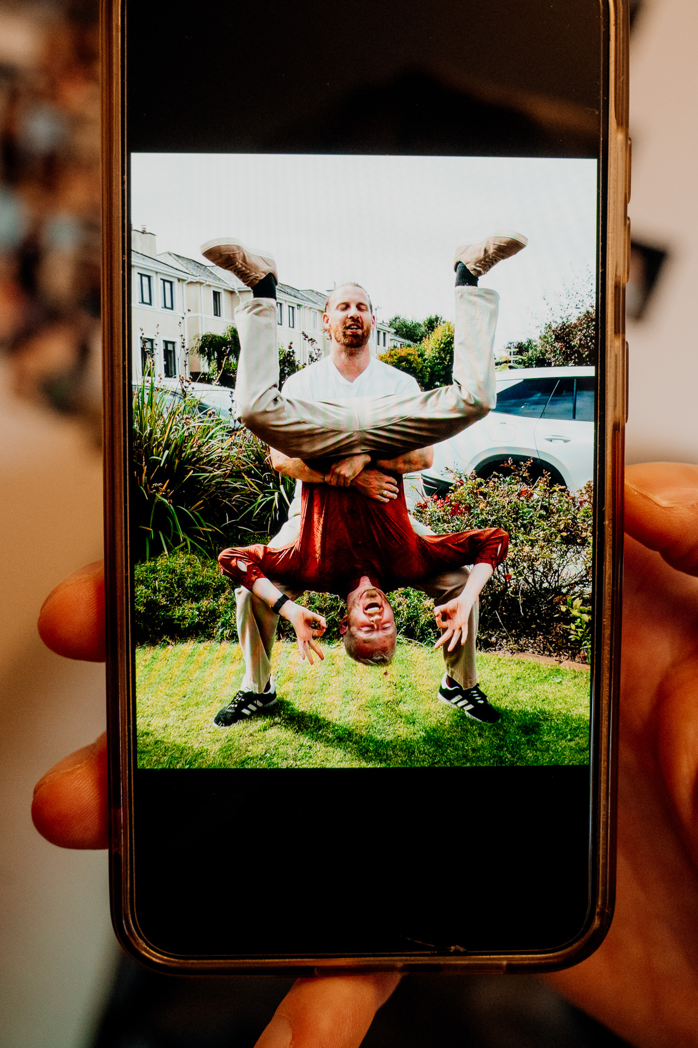 Groom having fun during wedding morning preparations at home
