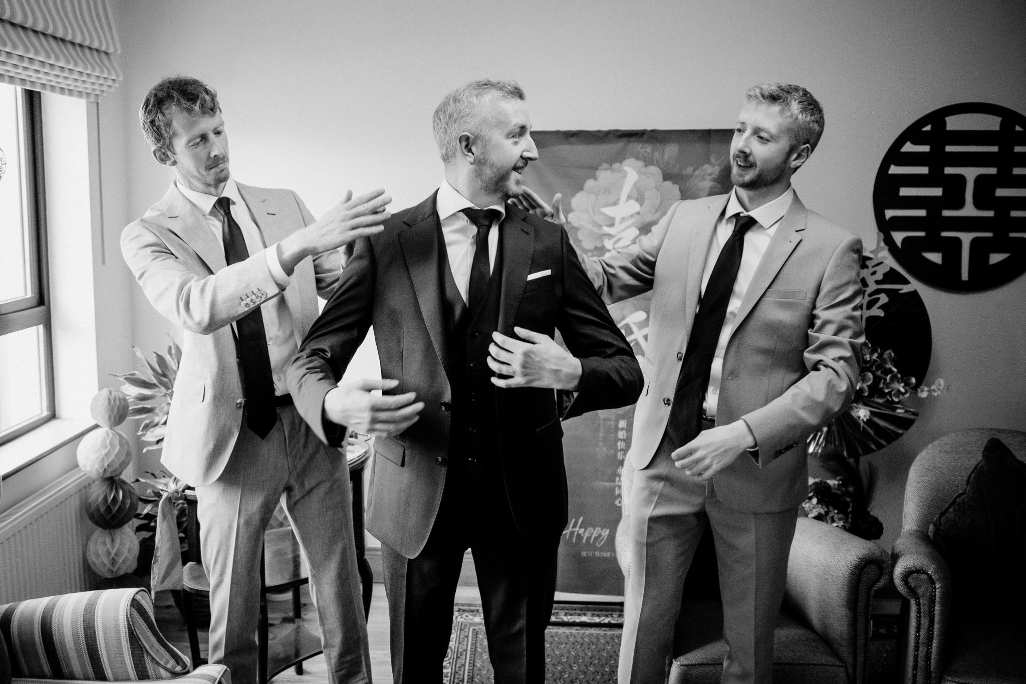 Groom and family raising a toast on the wedding morning