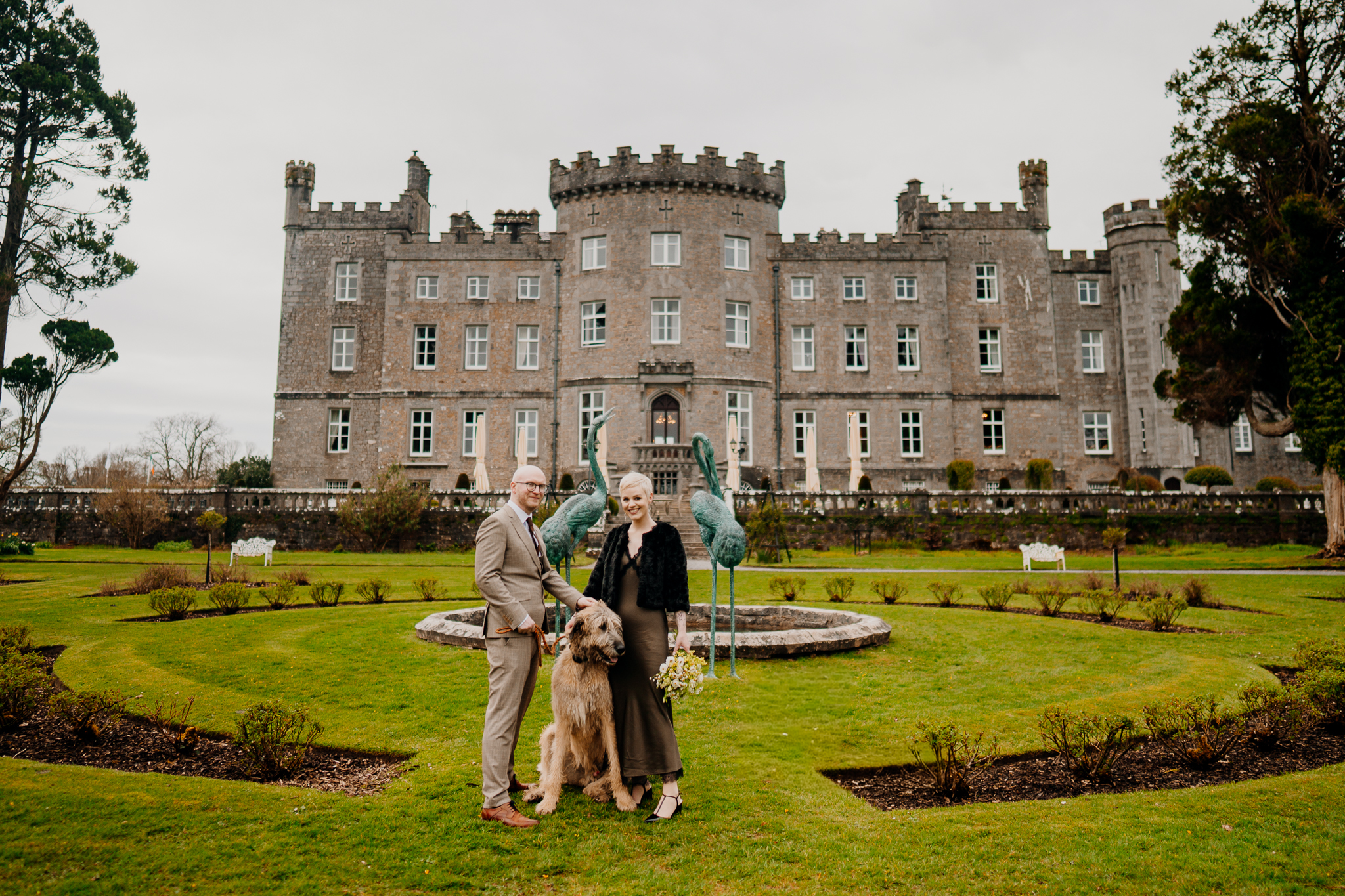 Fionn the Irish Wolfhound with newlyweds in the formal gardens of Markree Castle Sligo