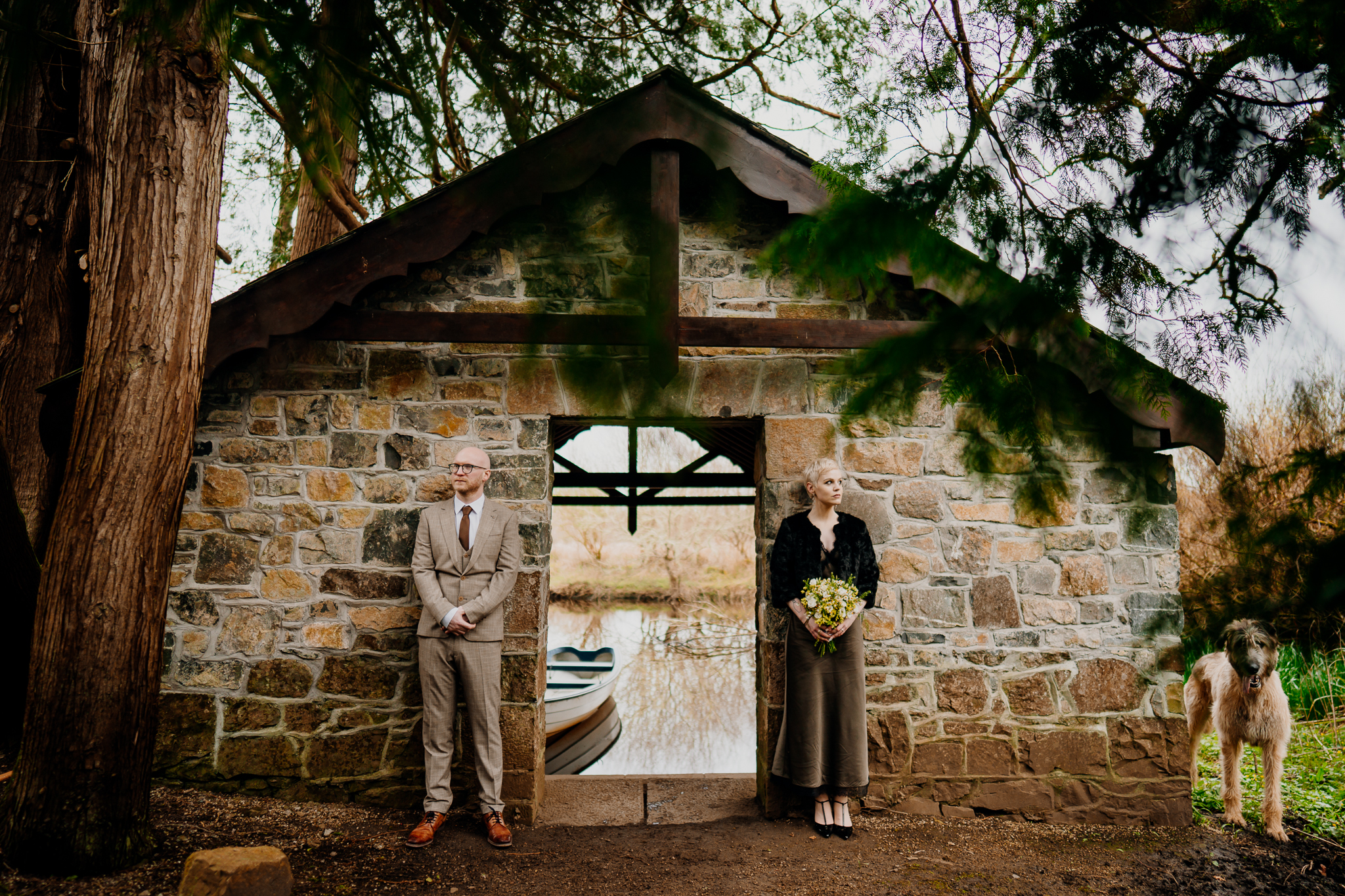 Historic Markree Castle Boathouse surrounded by woodland beside the water in Sligo