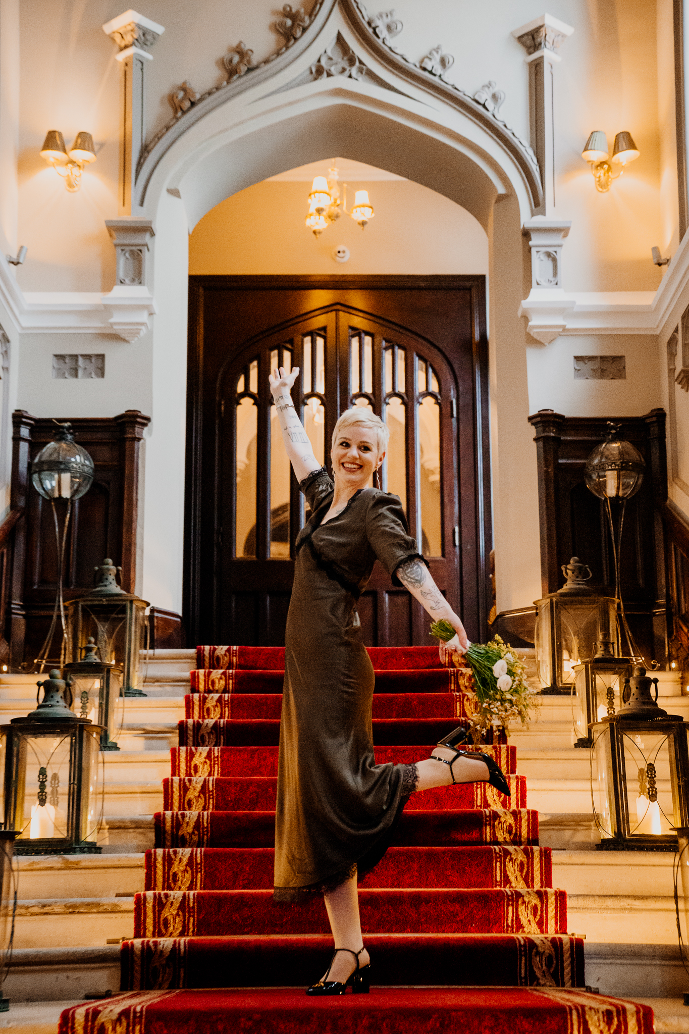 Newly married couple on the grand staircase inside Markree Castle wedding venue in Sligo