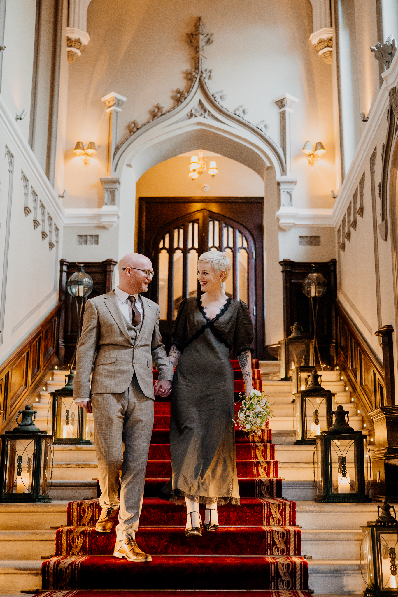Intimate wedding couple walking on the historic staircase inside Markree Castle Sligo