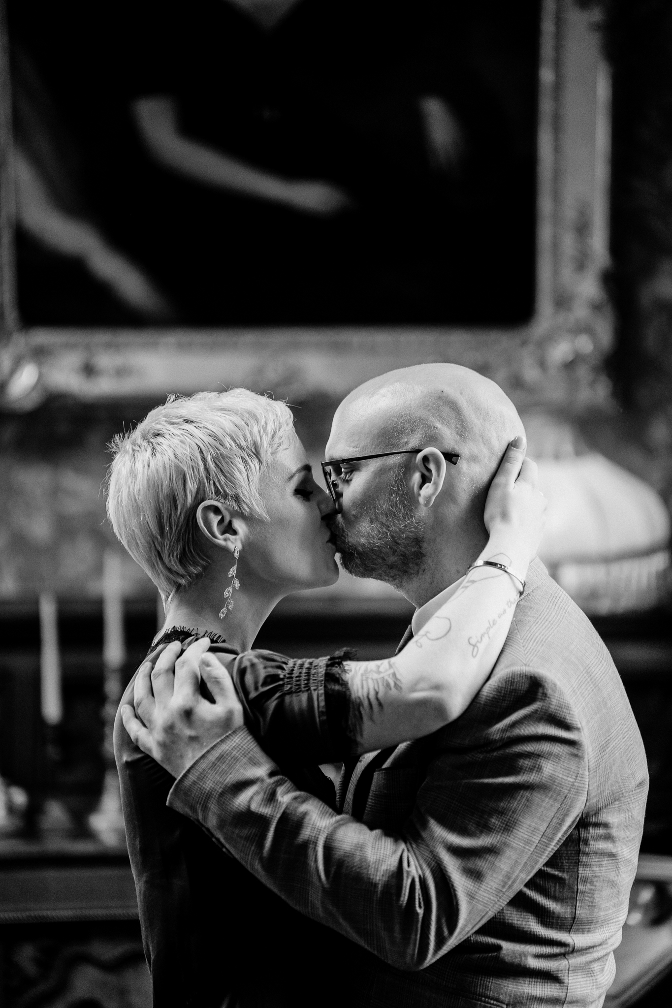 Black and white close-up of newlyweds kissing inside Markree Castle Billiard Room