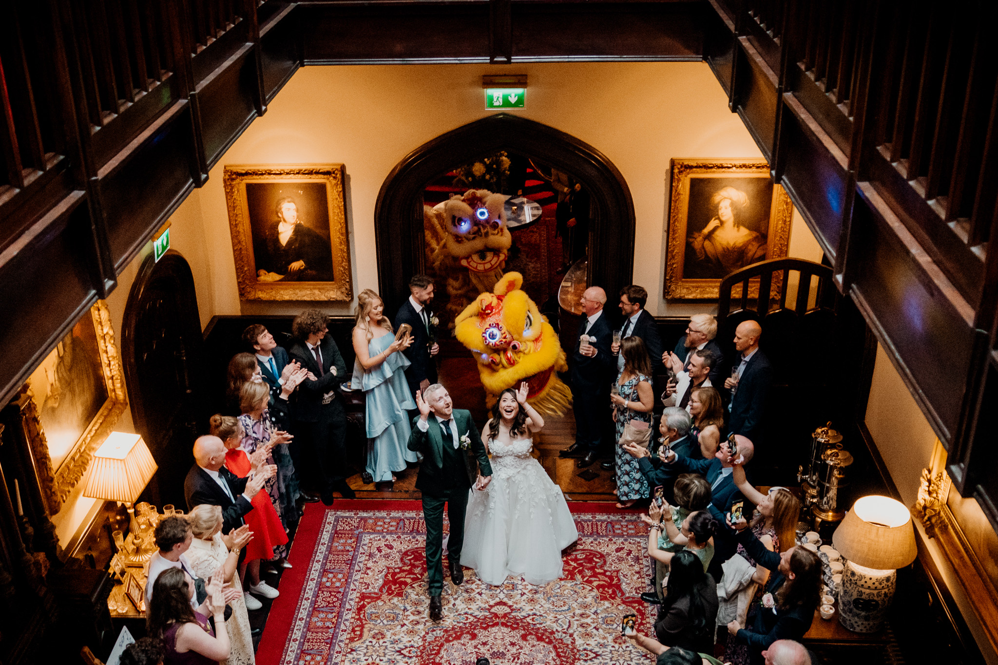 Bride and groom entering their Markree Castle wedding reception with a Chinese lion dance