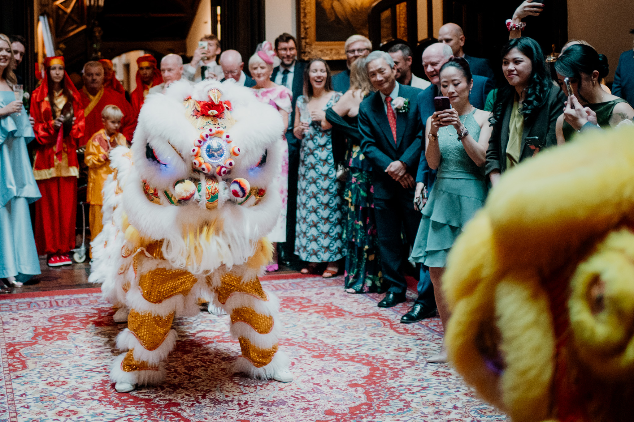 Chinese lion dance entertaining guests at a Markree Castle wedding reception