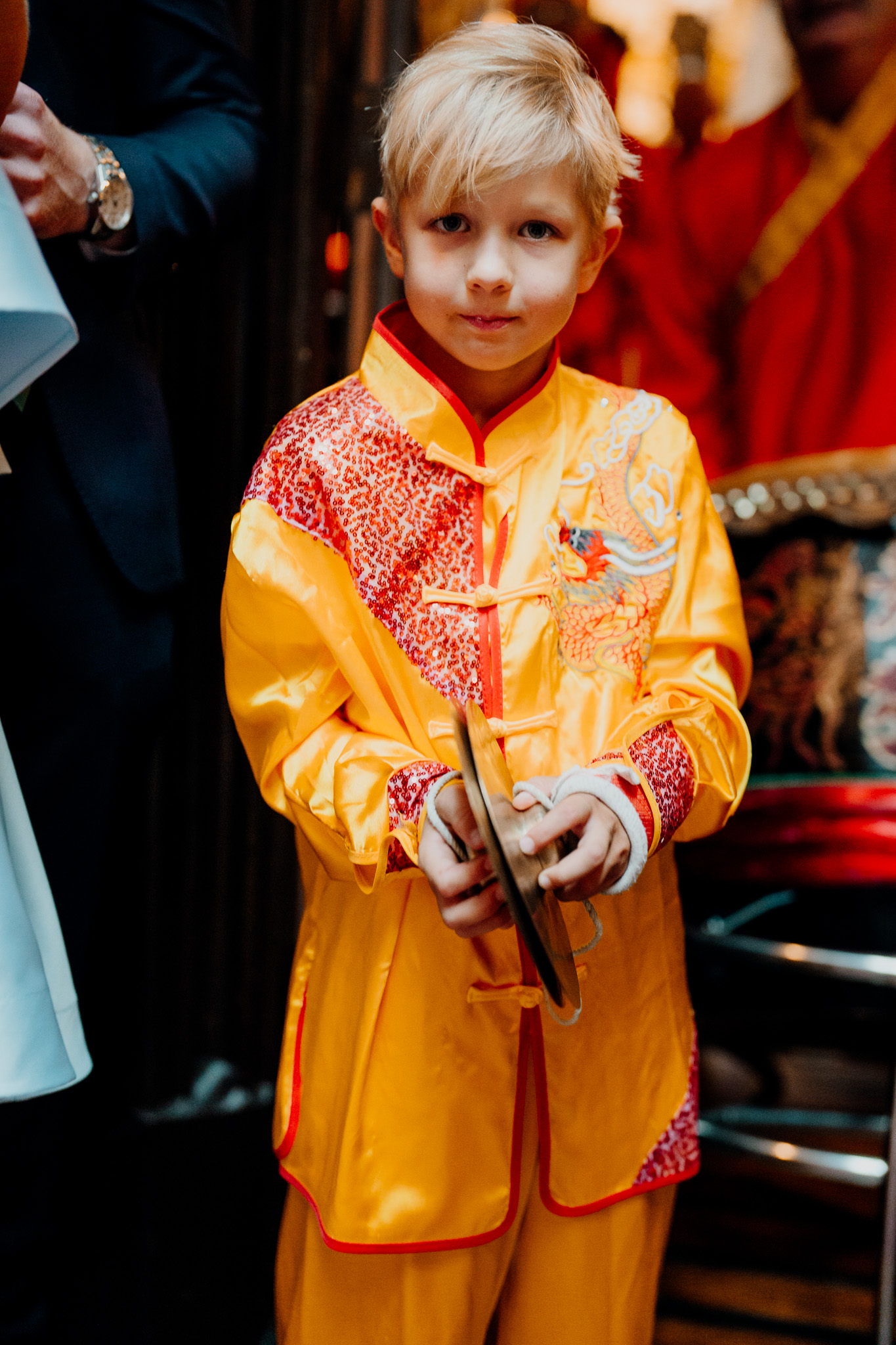 Child wearing traditional Chinese clothing at a Markree Castle wedding
