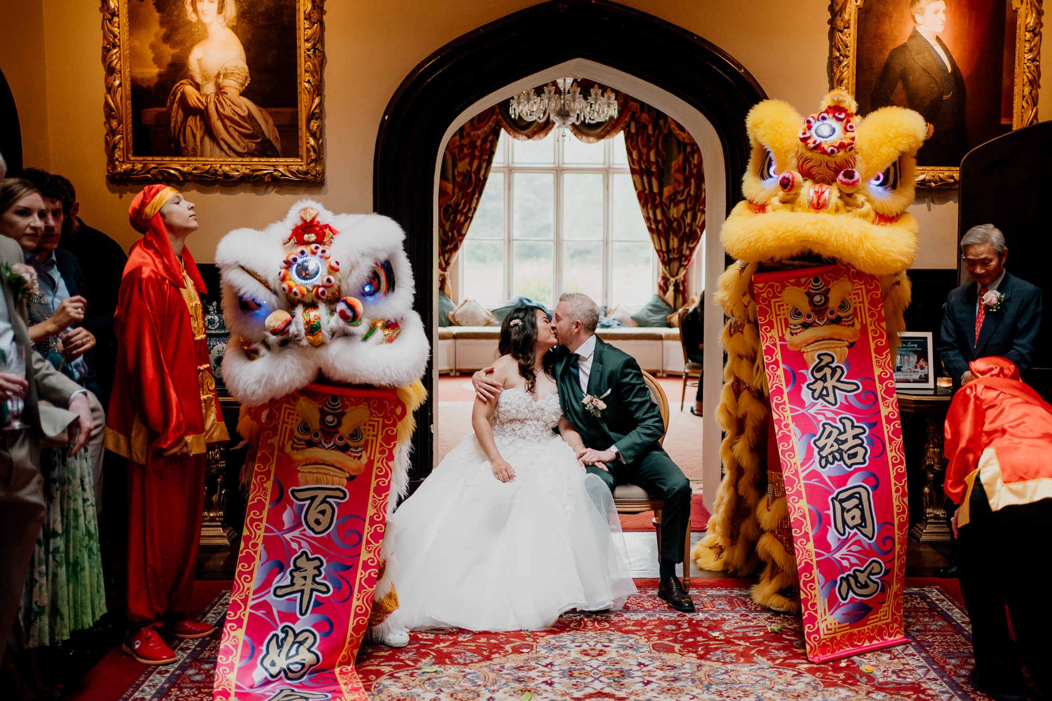 Bride and groom with Chinese lion dance performers at Markree Castle