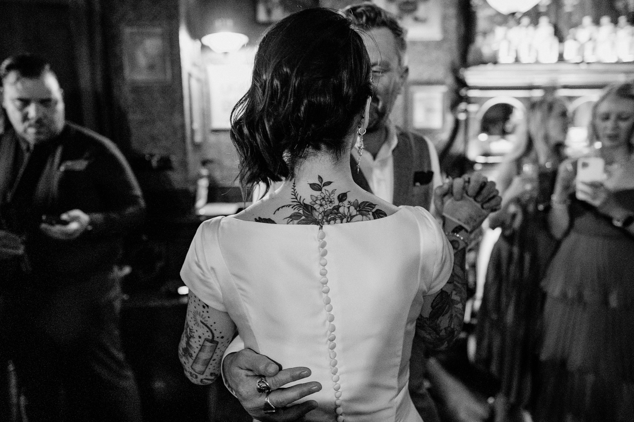 Intimate candid moment between wedding guests during the reception speeches at J.R. Mahon's Dublin