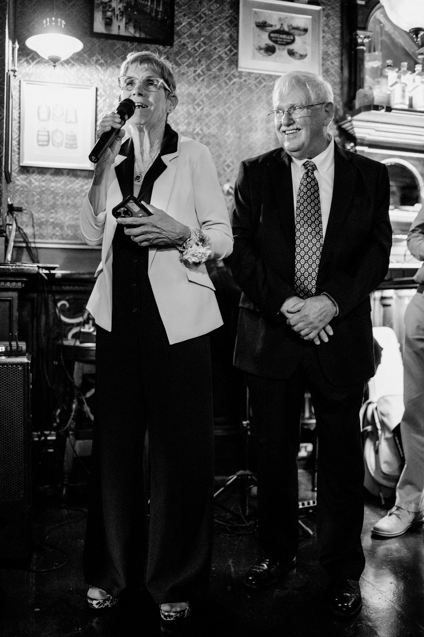 Woman holding speech notes beside a man during a wedding reception at J.R. Mahon's Dublin