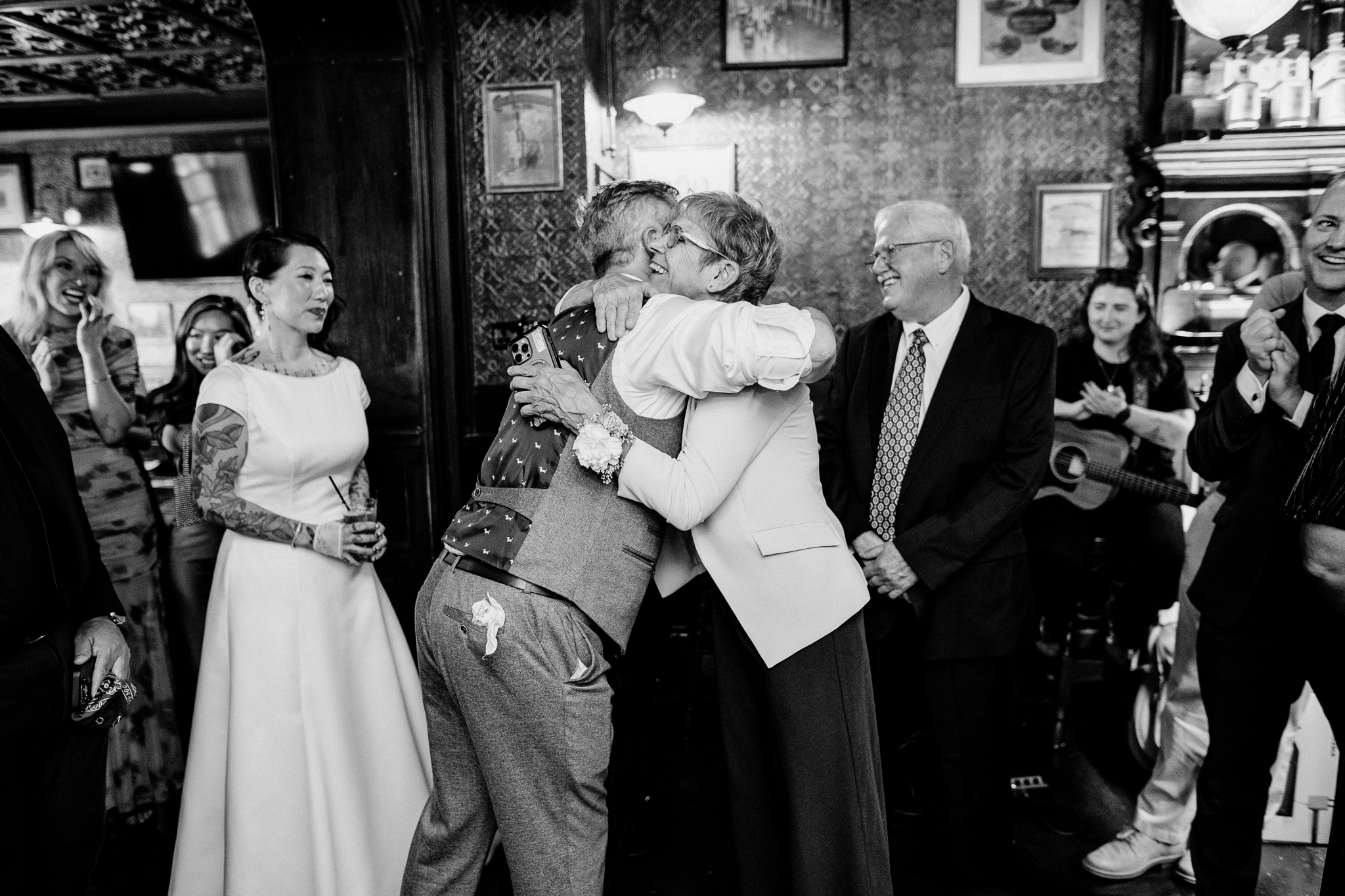 Emotional embrace between wedding guests during Pink and Joe's reception at J.R. Mahon's in Dublin