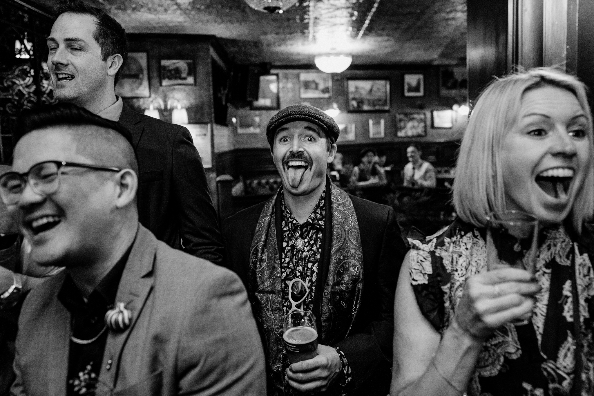 Smiling male wedding guest wearing a cap during the reception at J.R. Mahon's Dublin