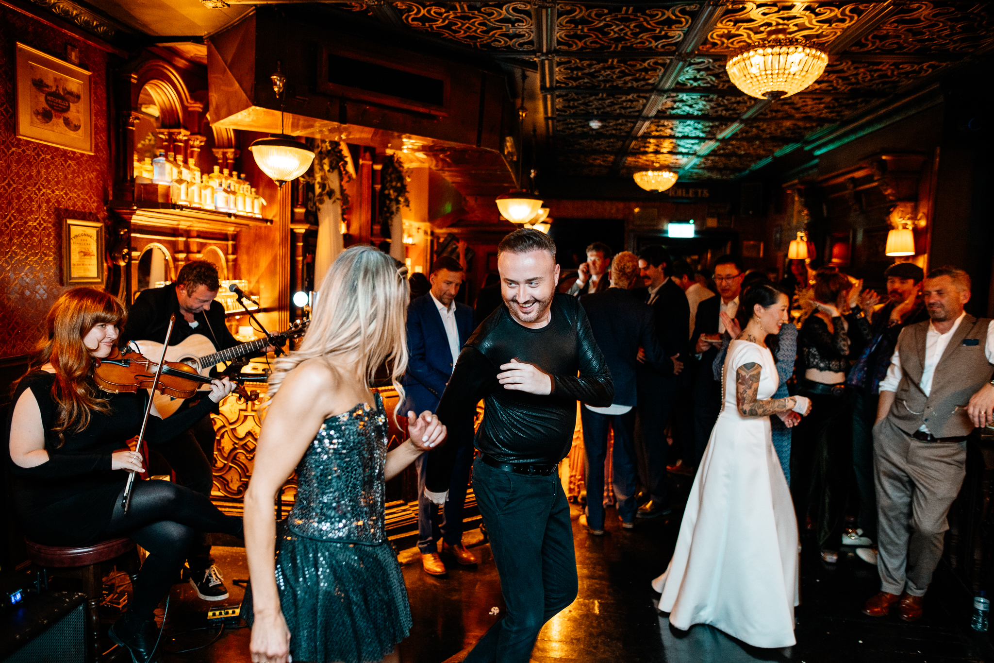 Wedding guests enjoying the evening celebration inside J.R. Mahon's pub in Dublin