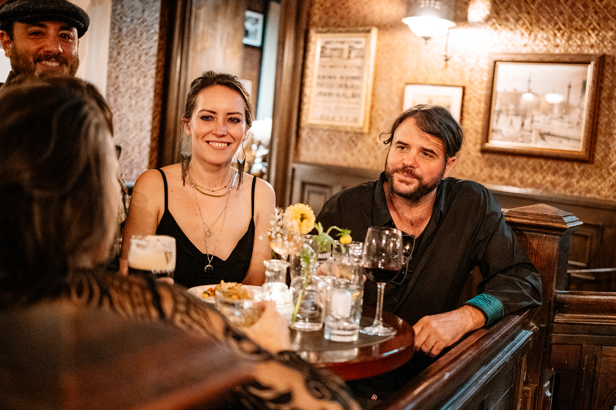 Smiling female wedding guest sitting beside a man during the reception at J.R. Mahon's Dublin