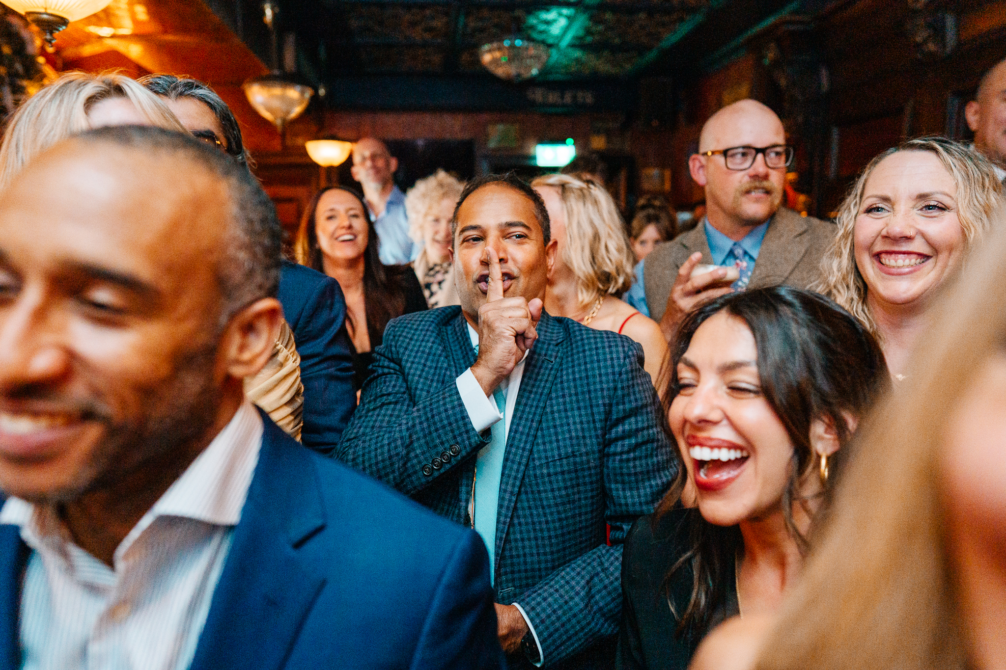 Wedding guests smiling and reacting to the entertainment during a reception at J.R. Mahon's Dublin