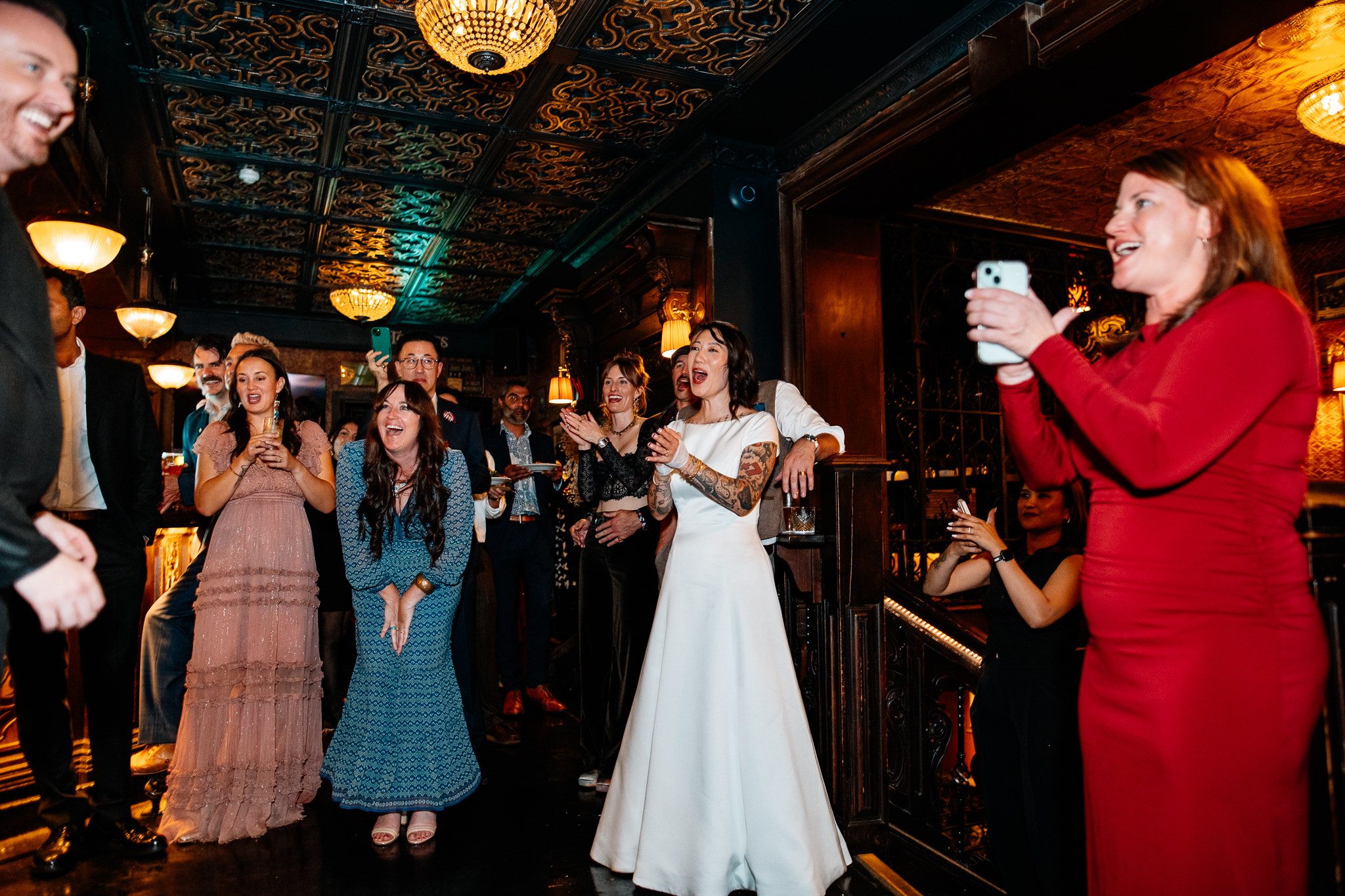 Wedding guests gathered inside the warmly lit interior of J.R. Mahon's during a Dublin wedding reception
