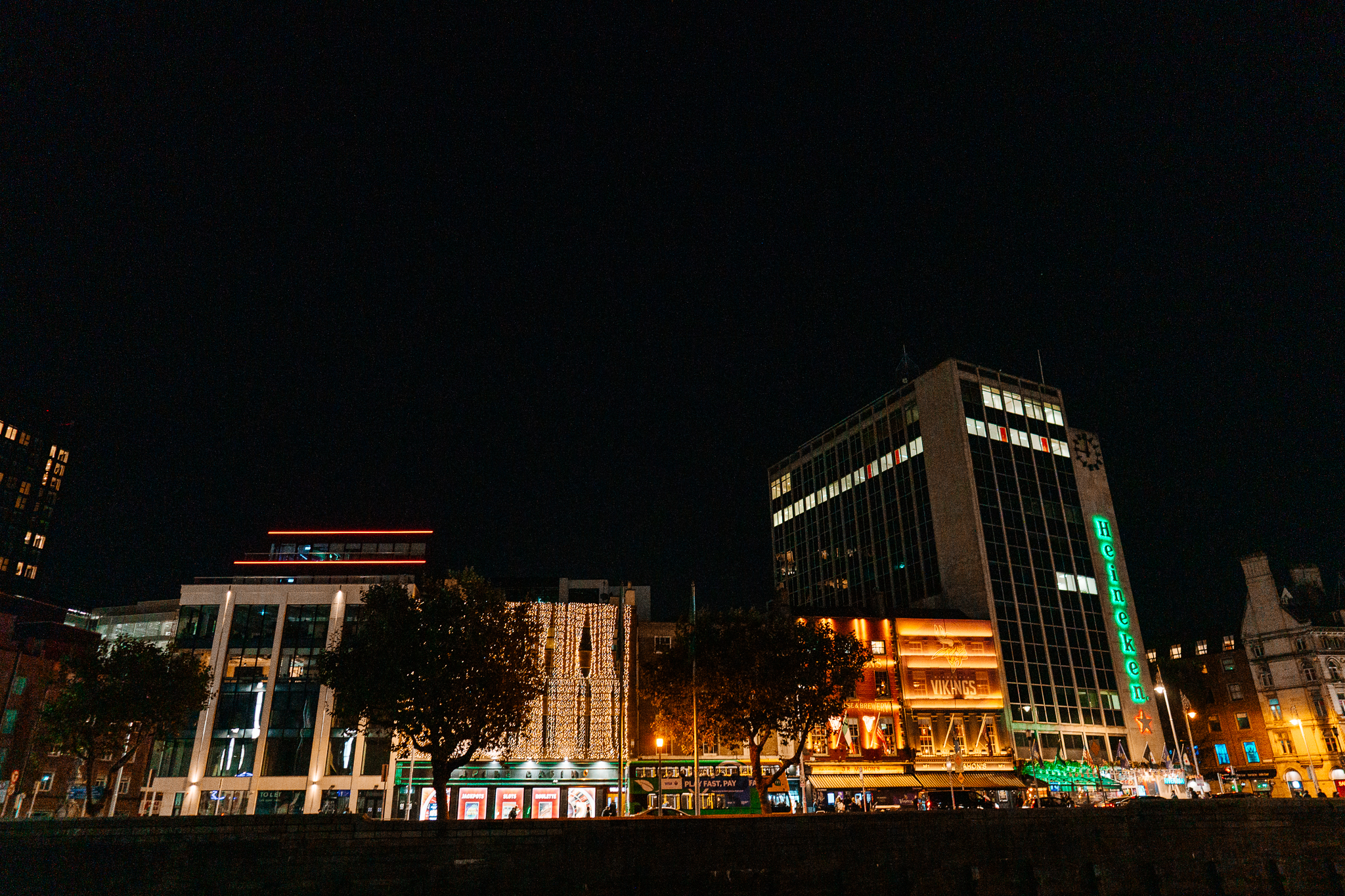 Illuminated modern building against the night sky in Dublin after Pink and Joe's wedding reception