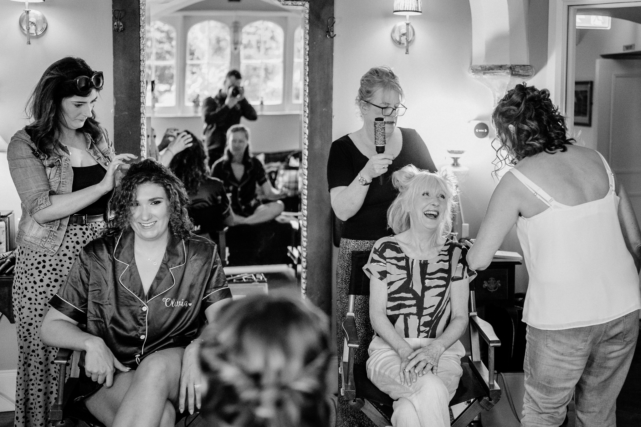 Candid laughter during bridal preparations with bridesmaids in the Butler's Kitchen at Markree Castle.