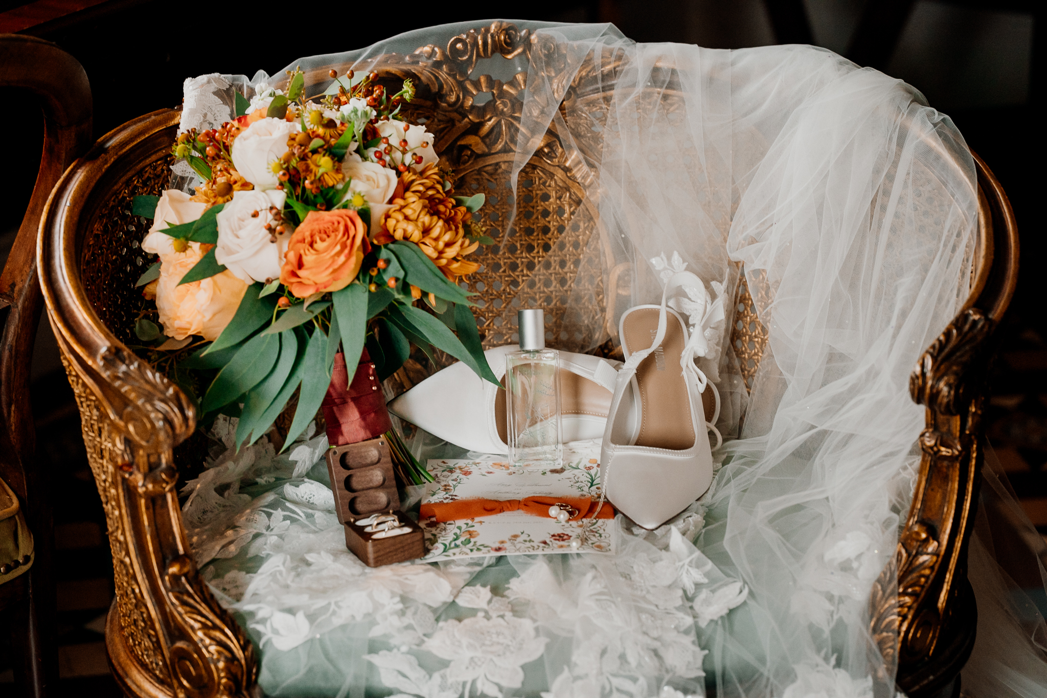 Colourful bridal bouquet with orange and peach flowers arranged by The Flower Shed for a Markree Castle wedding.