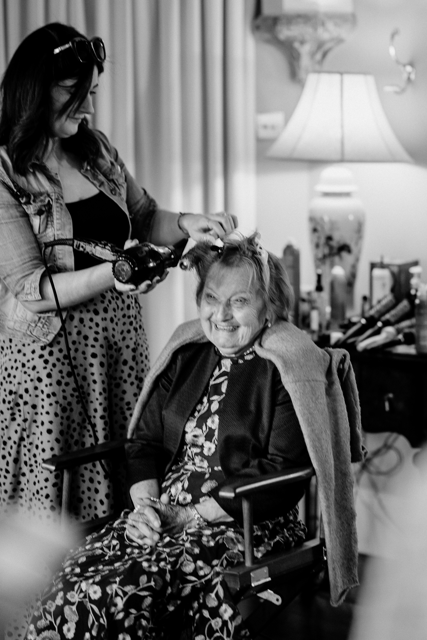 Bridal hairstyling during wedding morning preparations in the Butler's Kitchen at Markree Castle.
