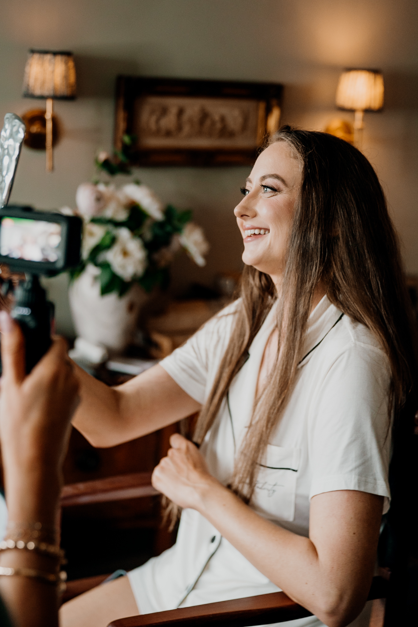 Natural bridal portrait of Amy smiling beside the window during wedding morning preparations at Markree Castle.
