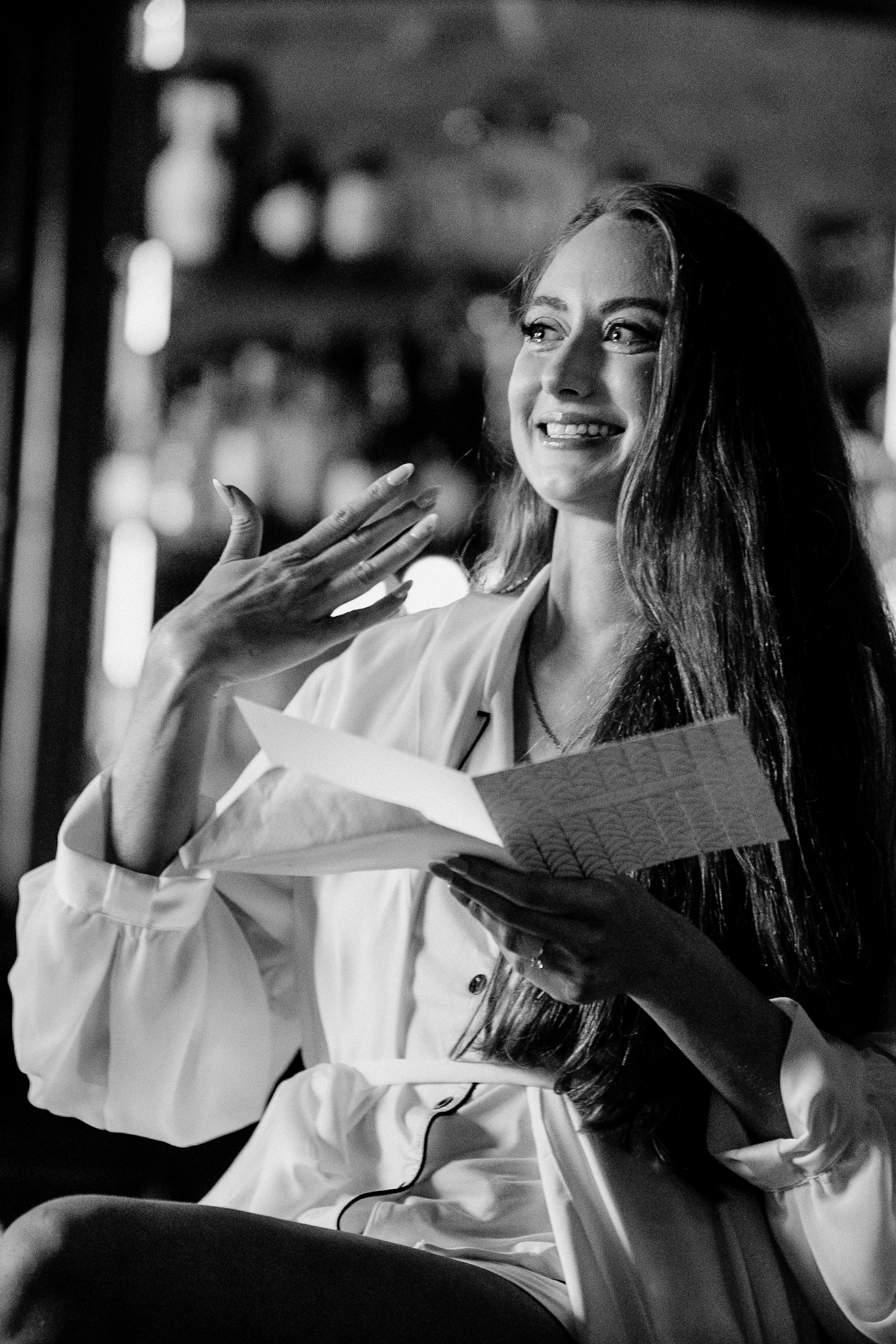 Black and white photograph of a smiling bride during hair preparations at Markree Castle in Ireland.
