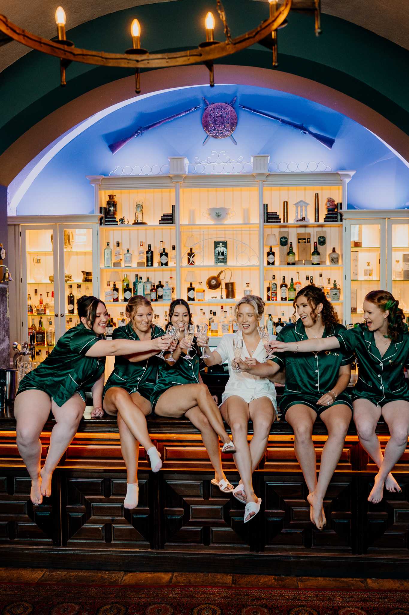 Bride and bridesmaids enjoying wedding morning preparations together in the Gin Bar at Markree Castle.