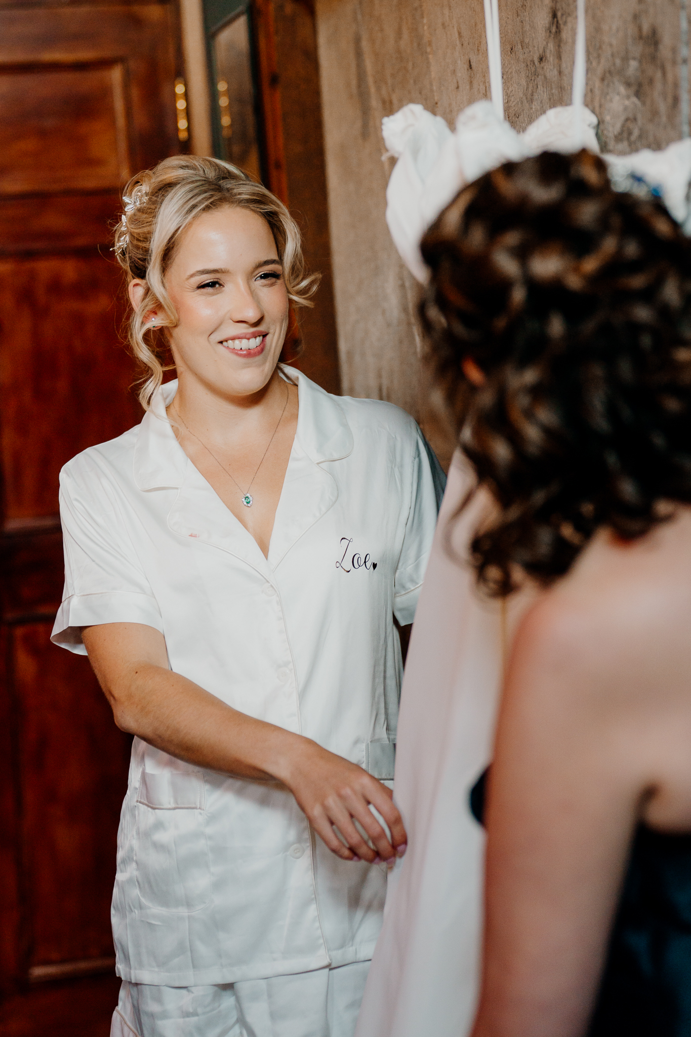 Bride chatting with a member of her bridal party during preparations in the Gin Bar at Markree Castle.