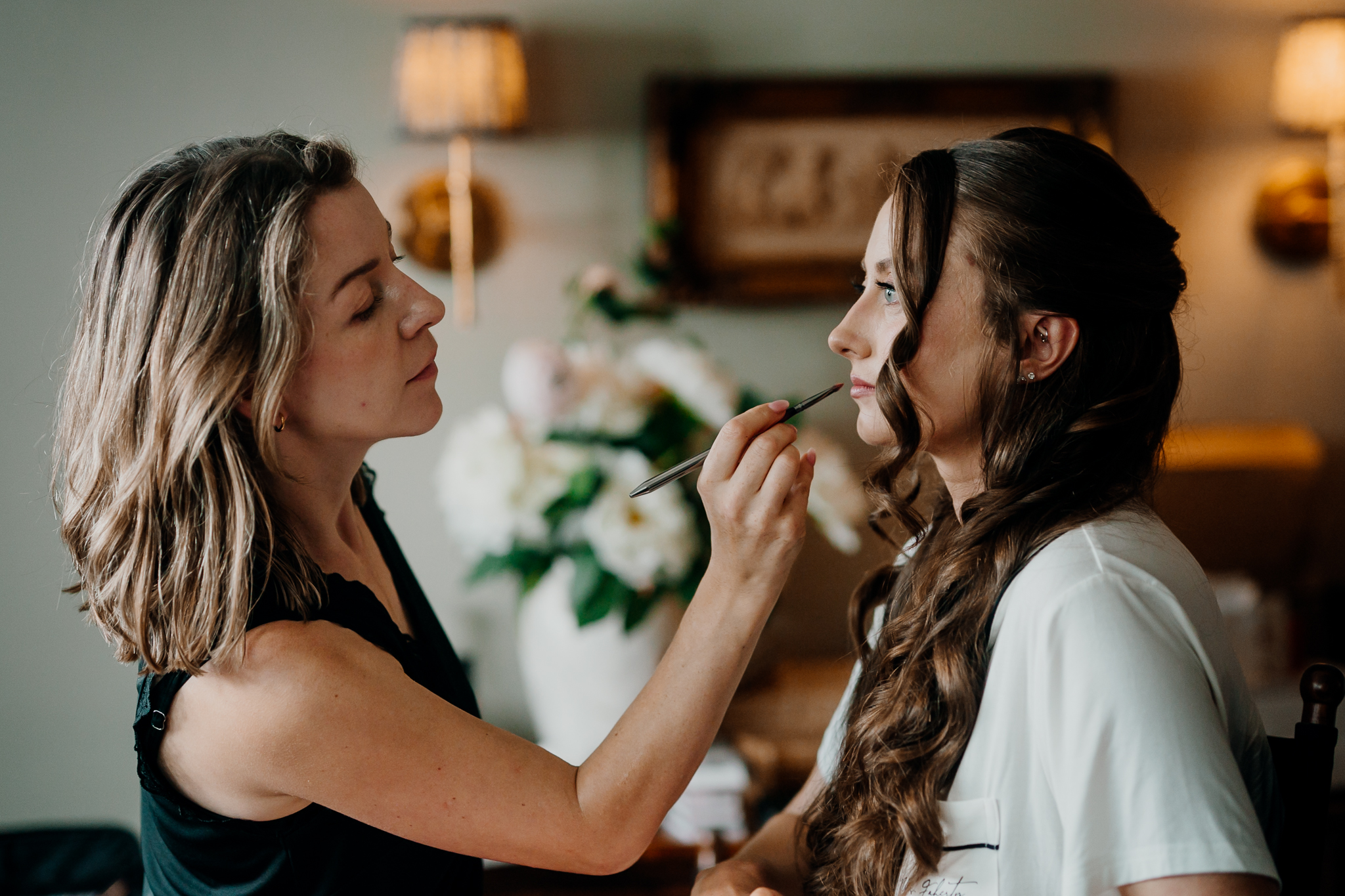 Bride smiling during a relaxed conversation while getting ready for her wedding at Markree Castle.