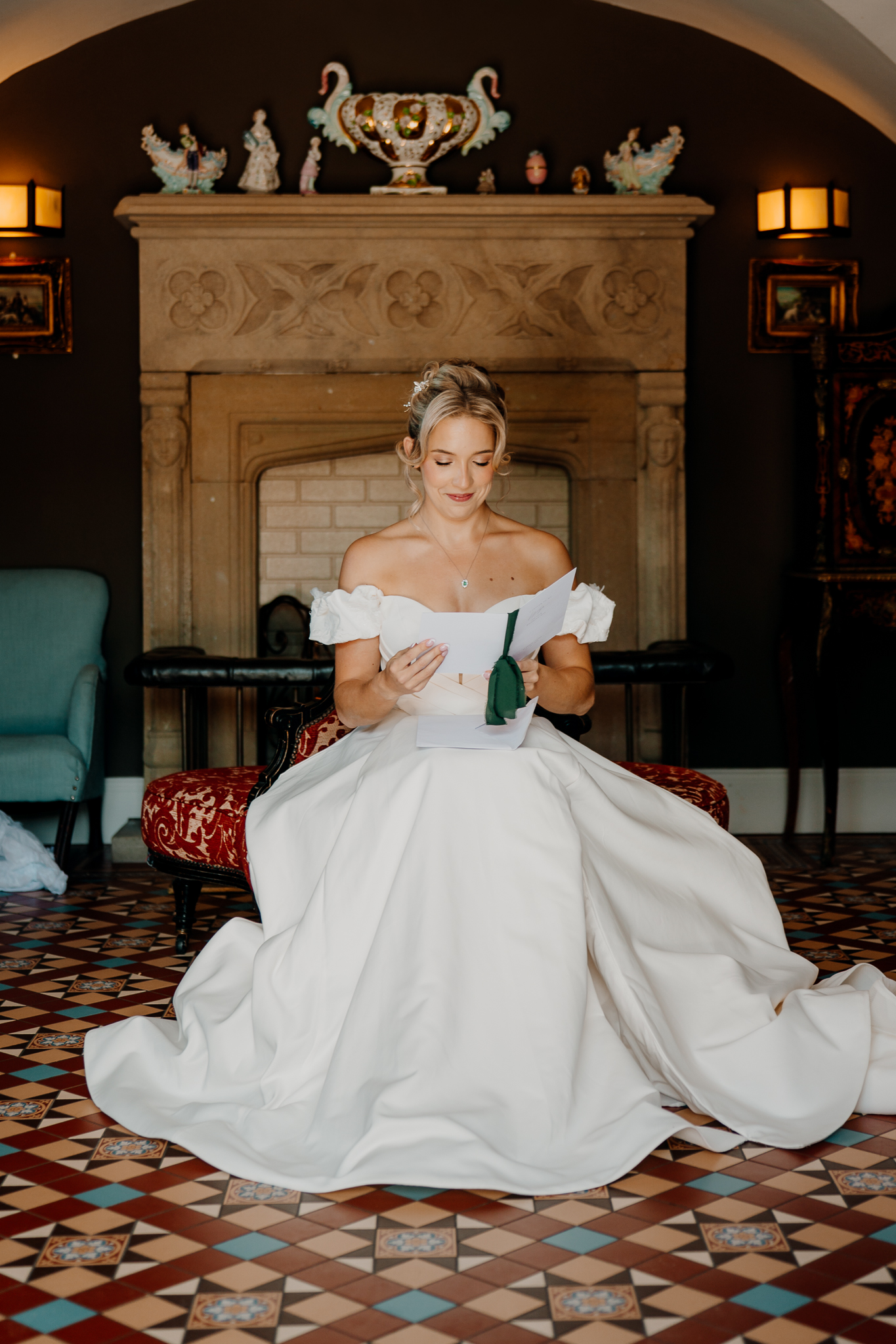 Bride reading a heartfelt letter from the groom in her wedding dress at Markree Castle, Sligo.