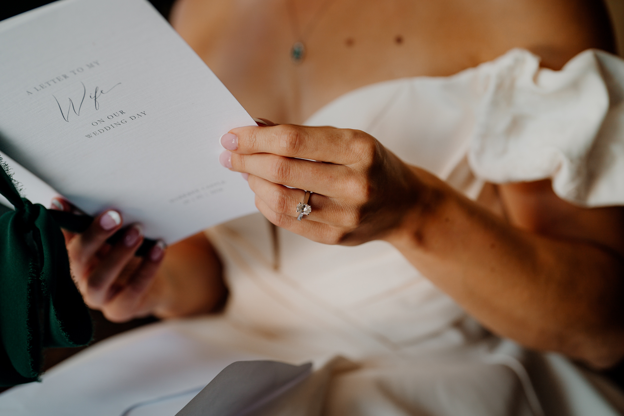 Close-up of a bride's hands holding a handwritten wedding morning letter at Markree Castle.