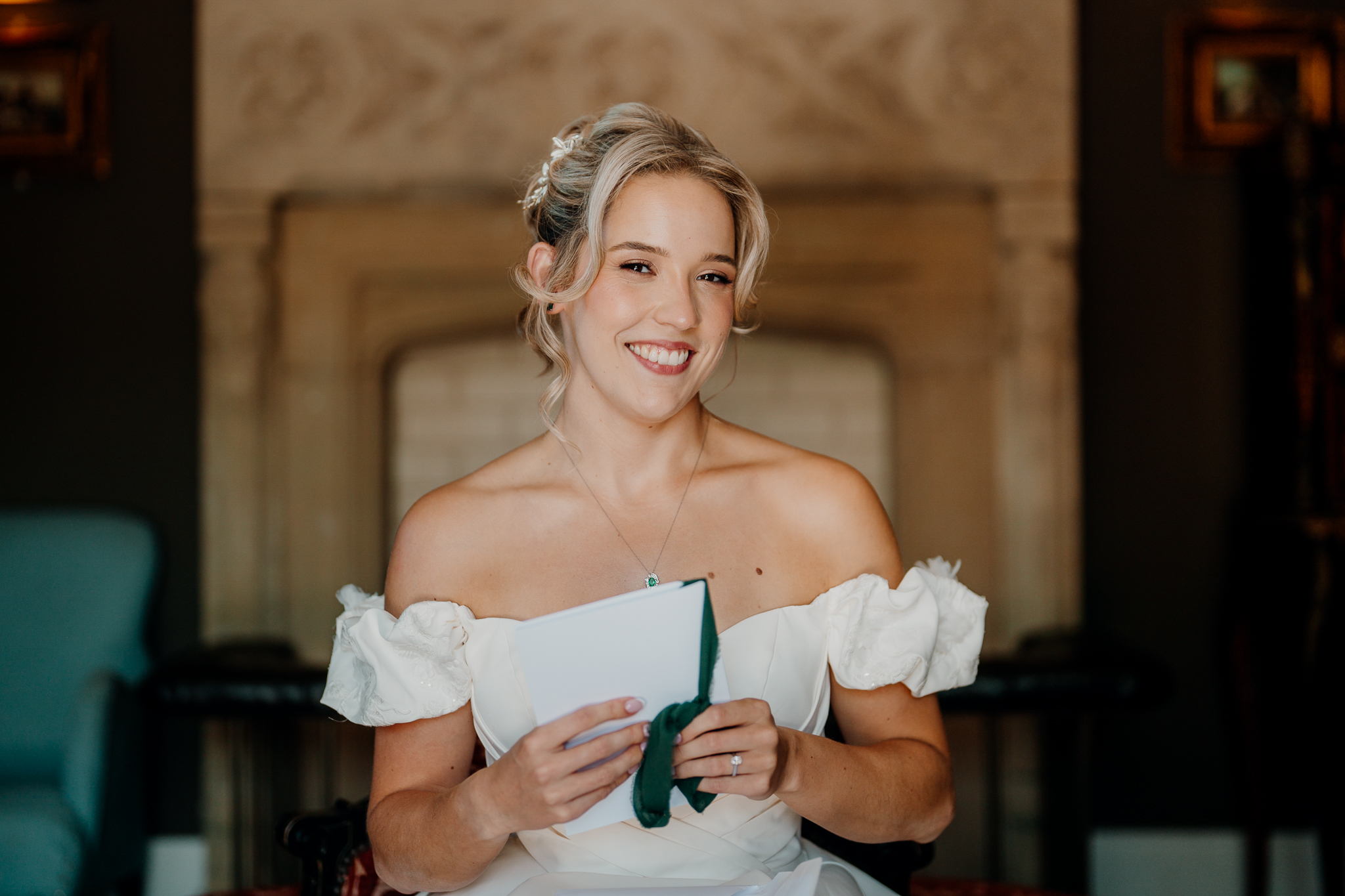 Bride holding a white bridal bouquet during wedding morning preparations at Markree Castle, Sligo.