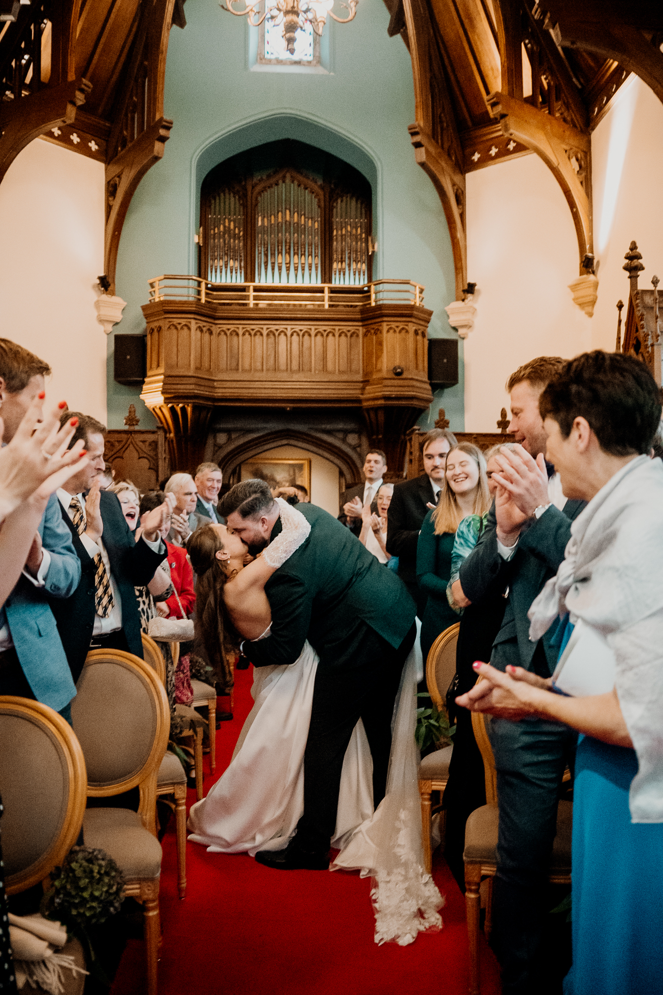 Wedding guests celebrating during a ceremony in the Markree Castle chapel